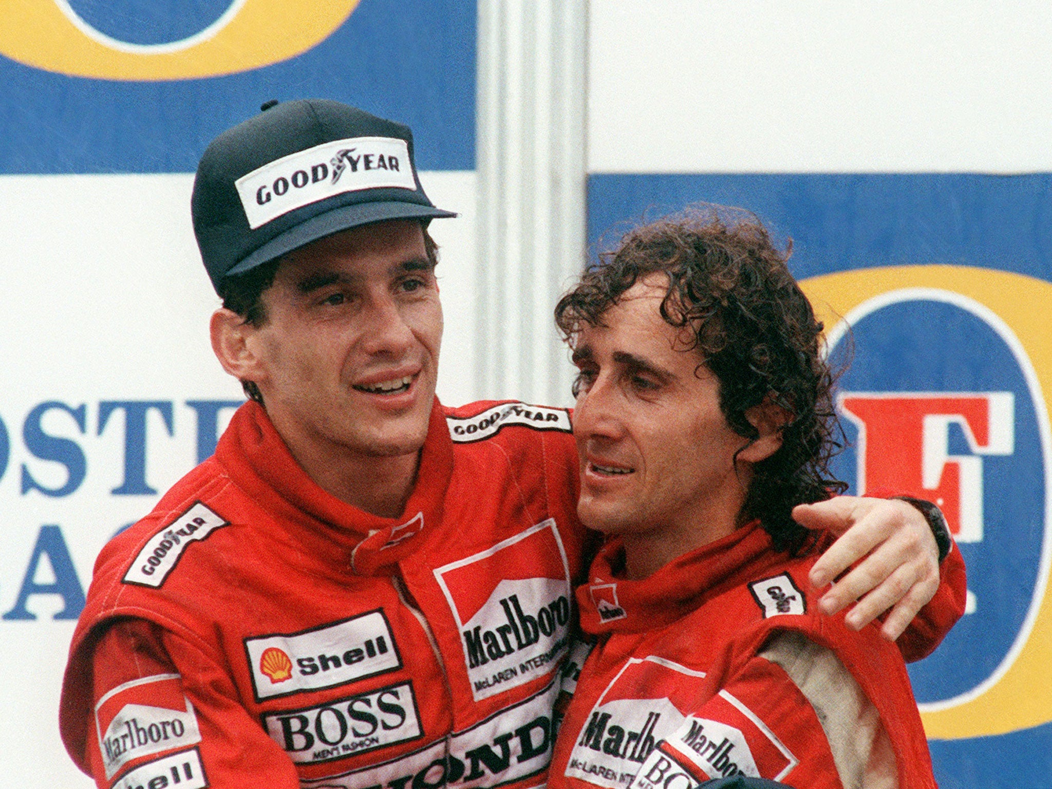 Alain Prost celebrates winning the 1988 Australian Grand Prix with Ayrton Senna