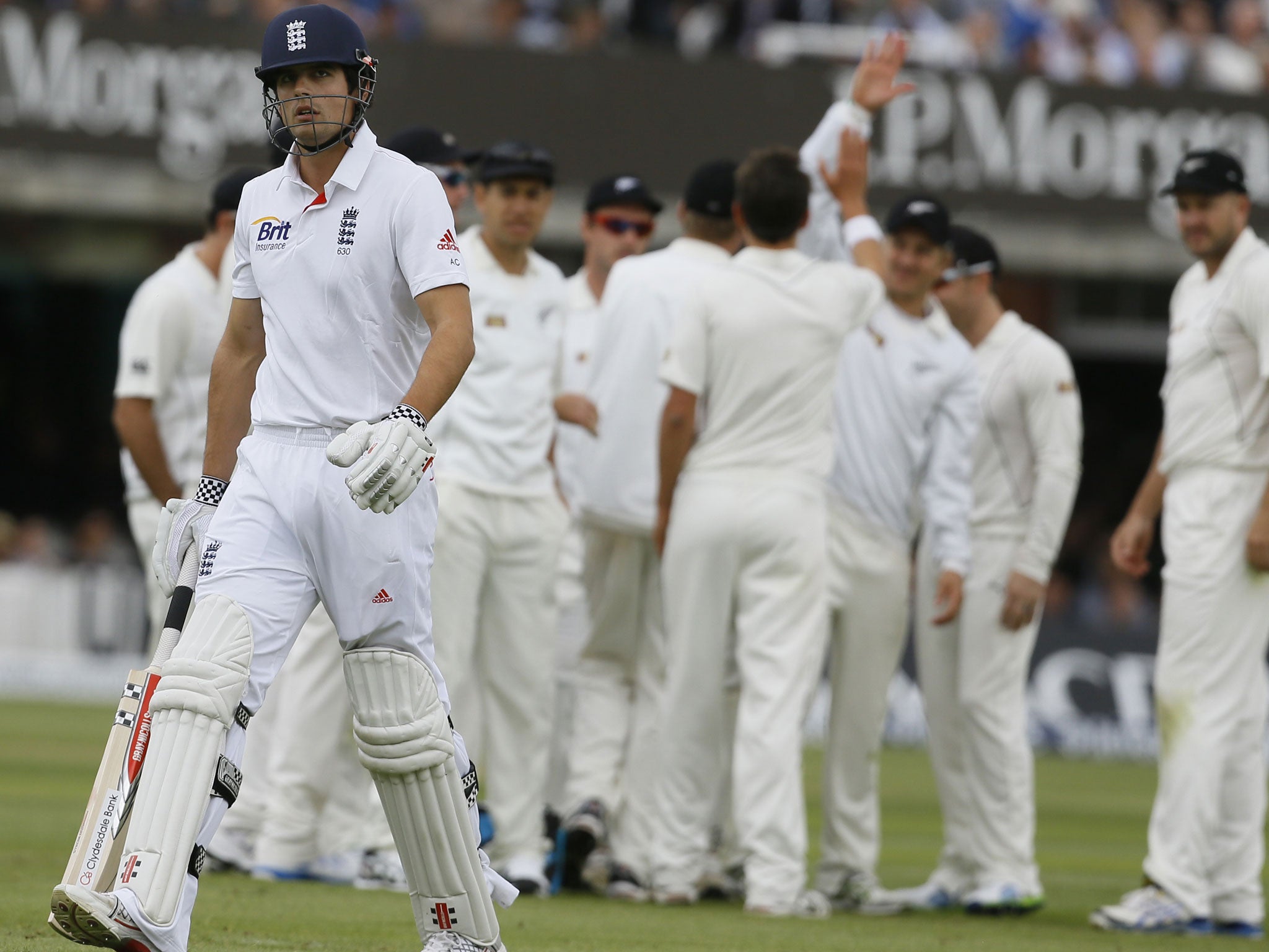 Alastair Cook leaves the pitch after being caught by BJ Watling