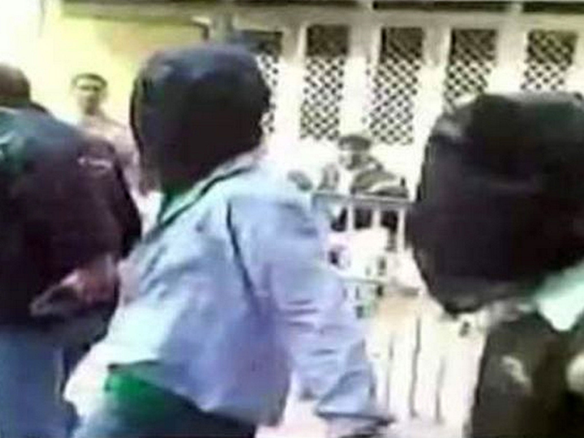 The accused are paraded before the media by Delhi police following their arrest