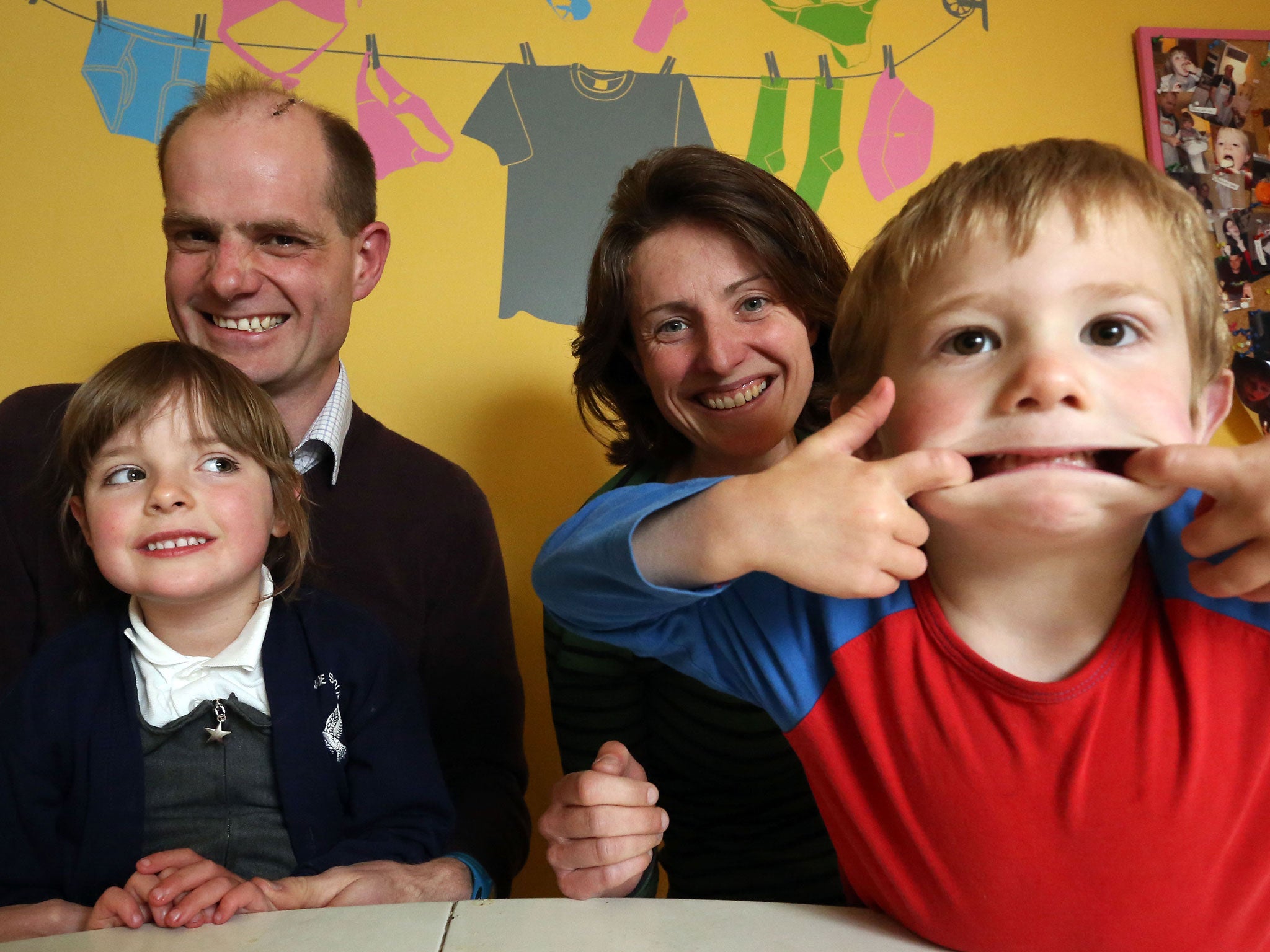 Happy families: Author Gideon Burrows with his wife, Sarah, and their children Erin and Reid