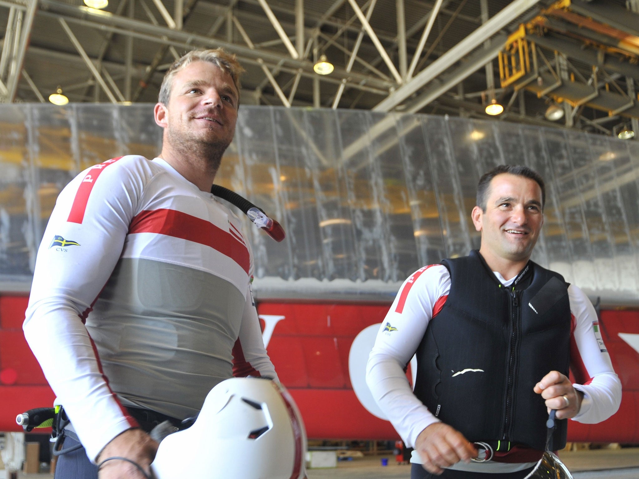 Safety first: Nick Hutton and Pierluigi De Felice of Luna Rossa show off their protective gear, which team boss Patrizio Bertelli wants enhanced