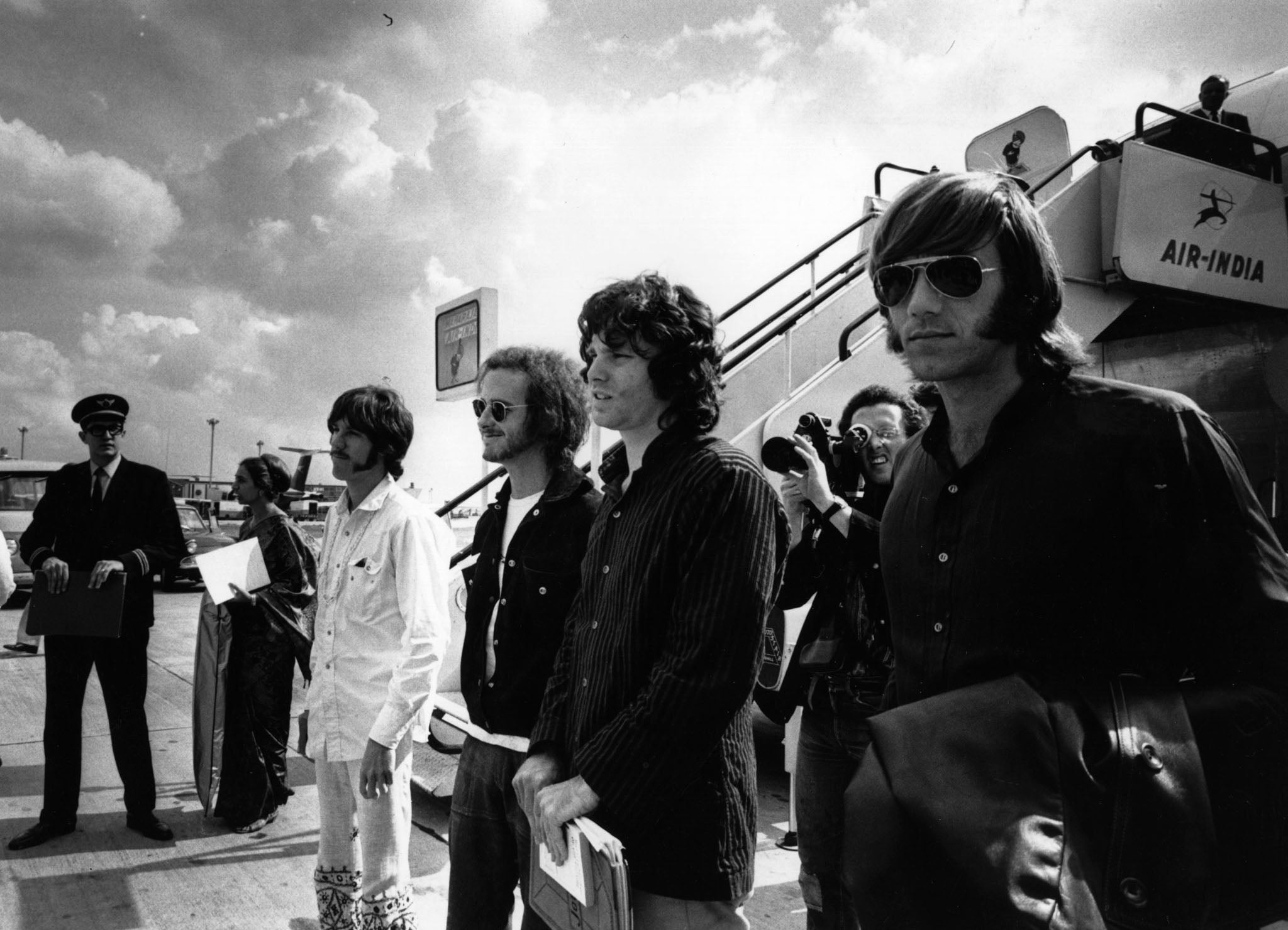 American rock group The Doors arrive at London Airport in 1968. From left to right; John Densmore, Bobby Krieger, Jim Morrison (1943 - 1971) and Ray Manzarek.