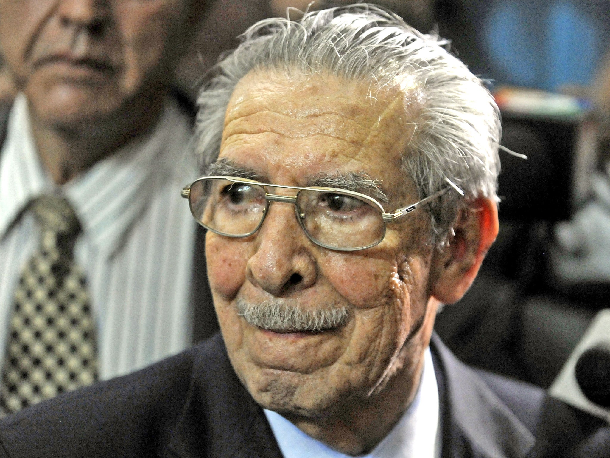 General Efrain Rios Montt listens in court yesterday