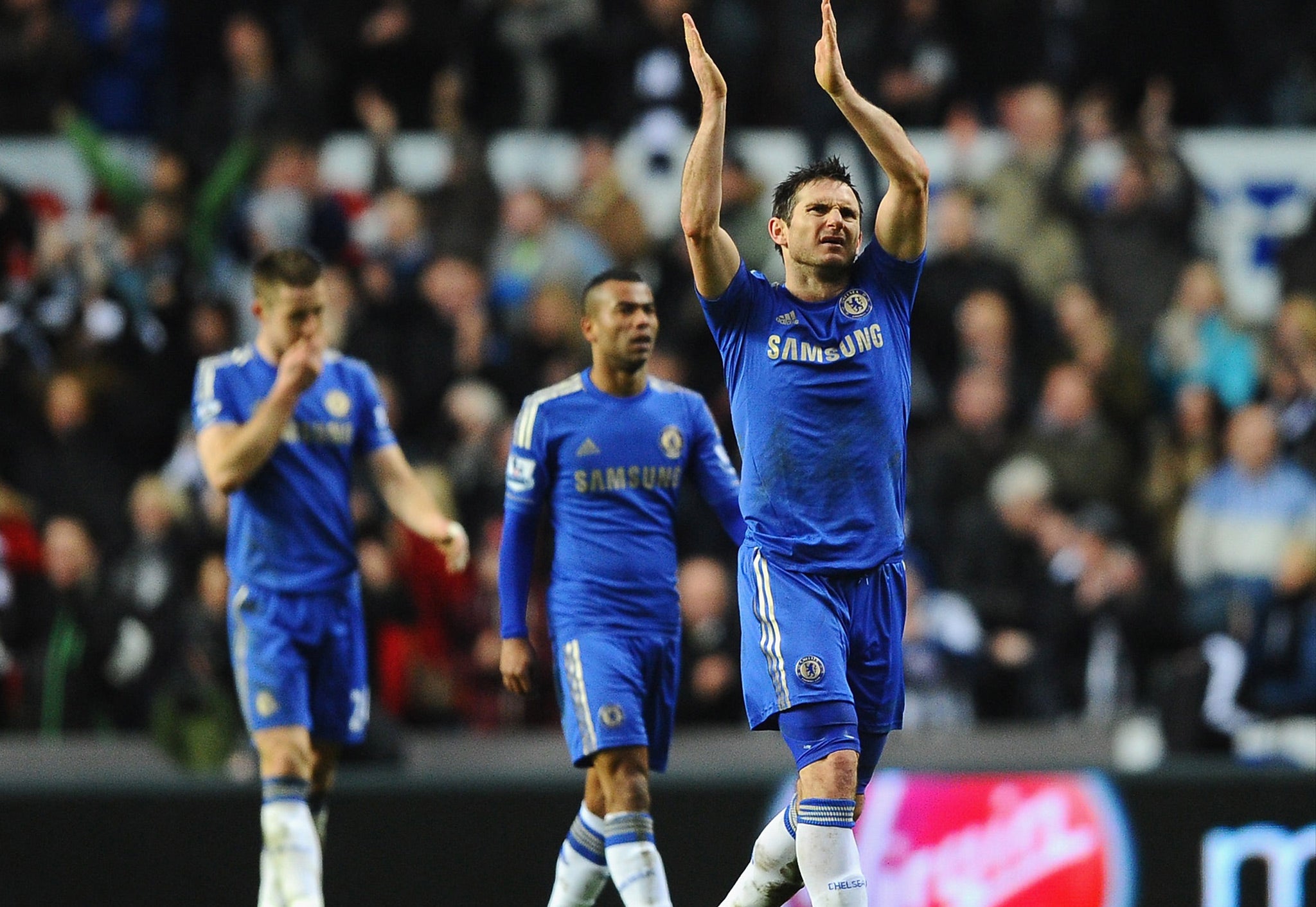 Frank Lampard applauds the crowd with Ashley Cole and Gary Cahill looking on