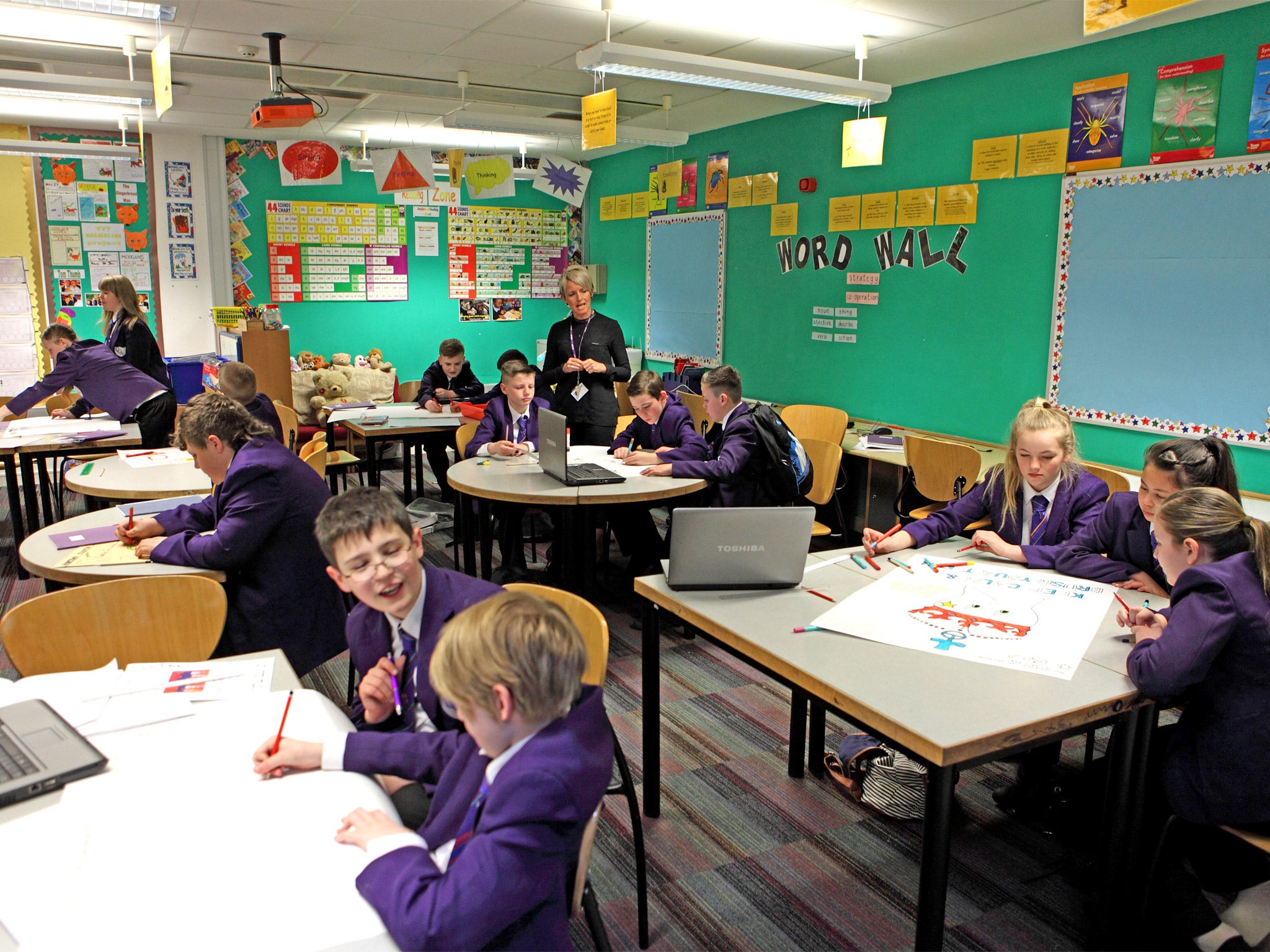 Read all about it: pupils at work during class at Unity Academy