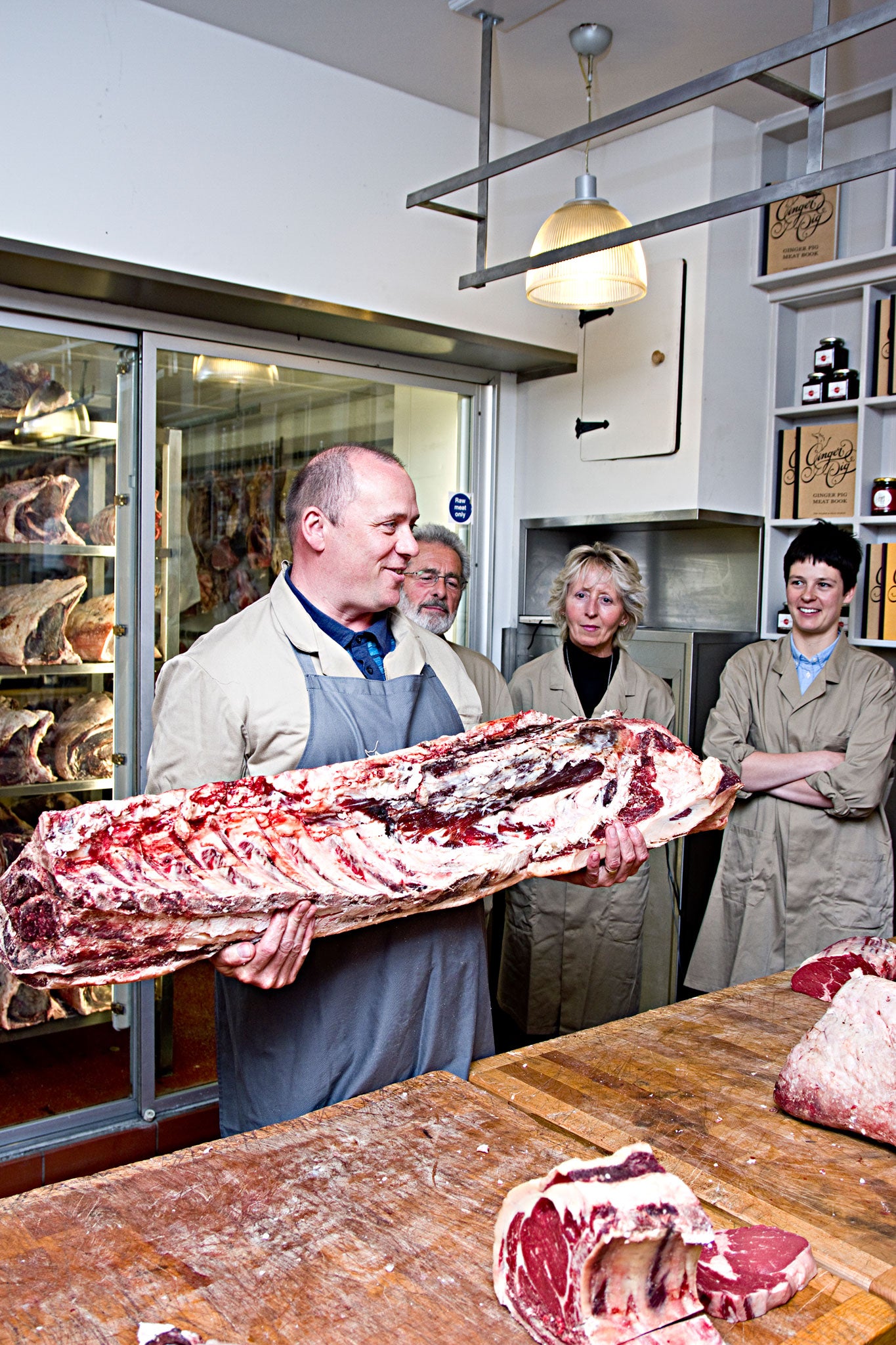 Meat and greet: Perry instructs the students in butchery at the Ginger Pig in London's Marylebone