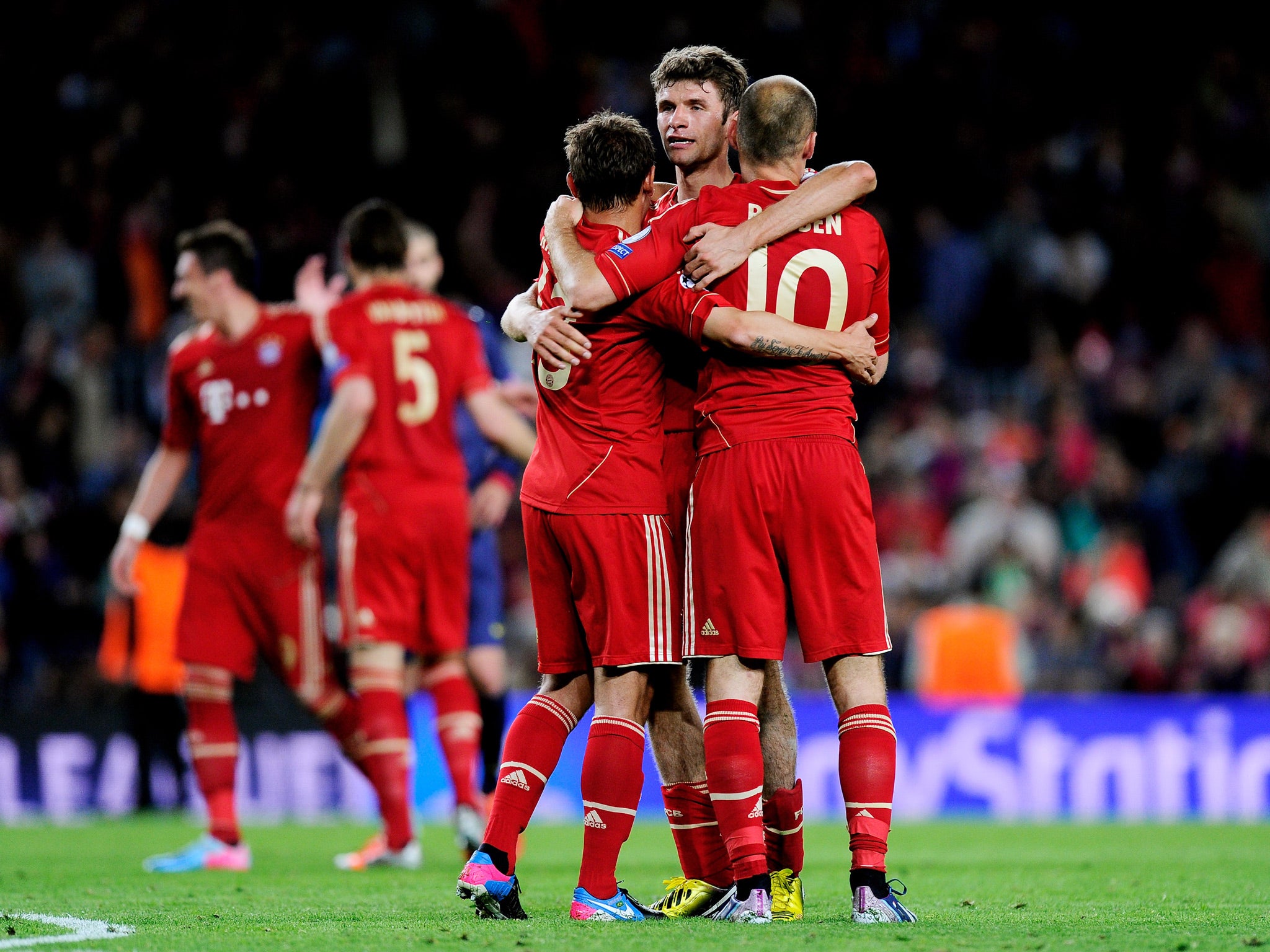 Rafinha, Thomas Muller and Arjen Robben of Munich celebrate reaching the fina