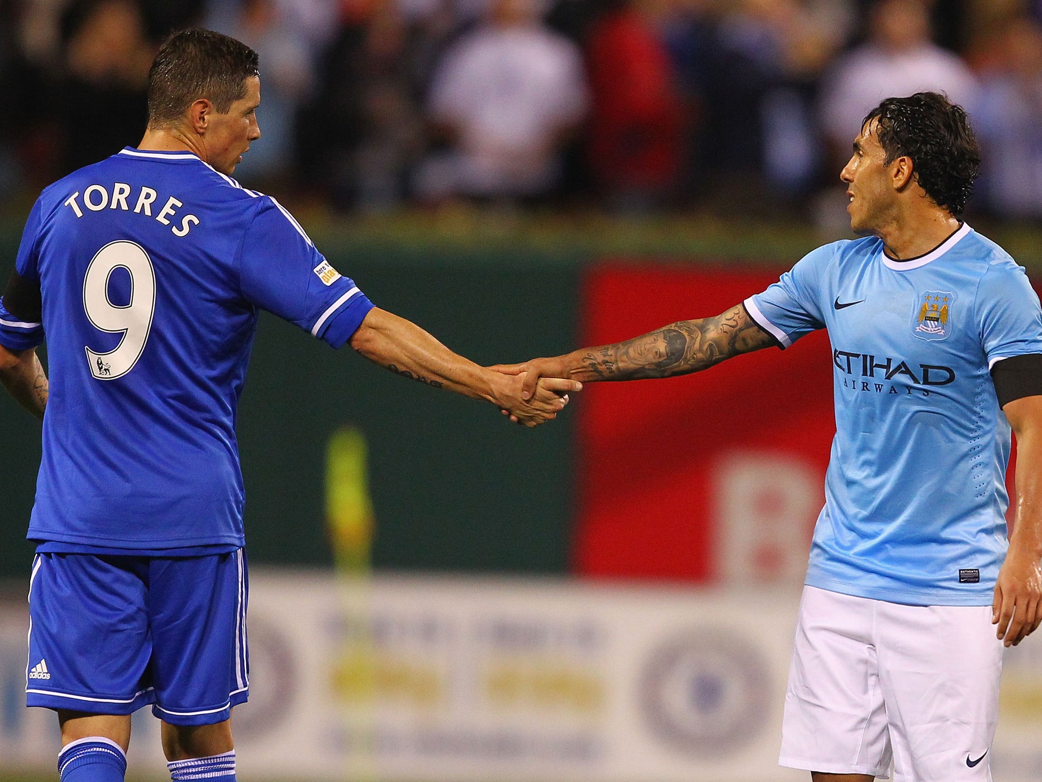 Fernando Torres #9 of Chelsea shakes hands with Carlos Tevez #32 of Manchester City after playing during a friendly match at Busch Stadium on May 23, 2013 in St. Louis