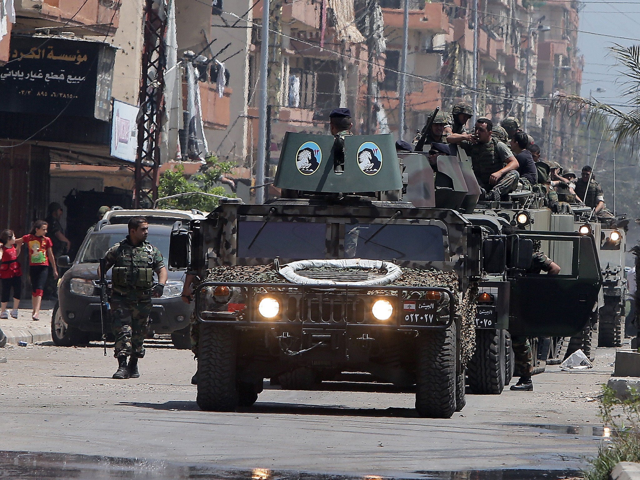 Lebanese soldiers deploy along the demarcation line between Tripoli's Sunni Muslim Bab al-Tabbneh Syria street