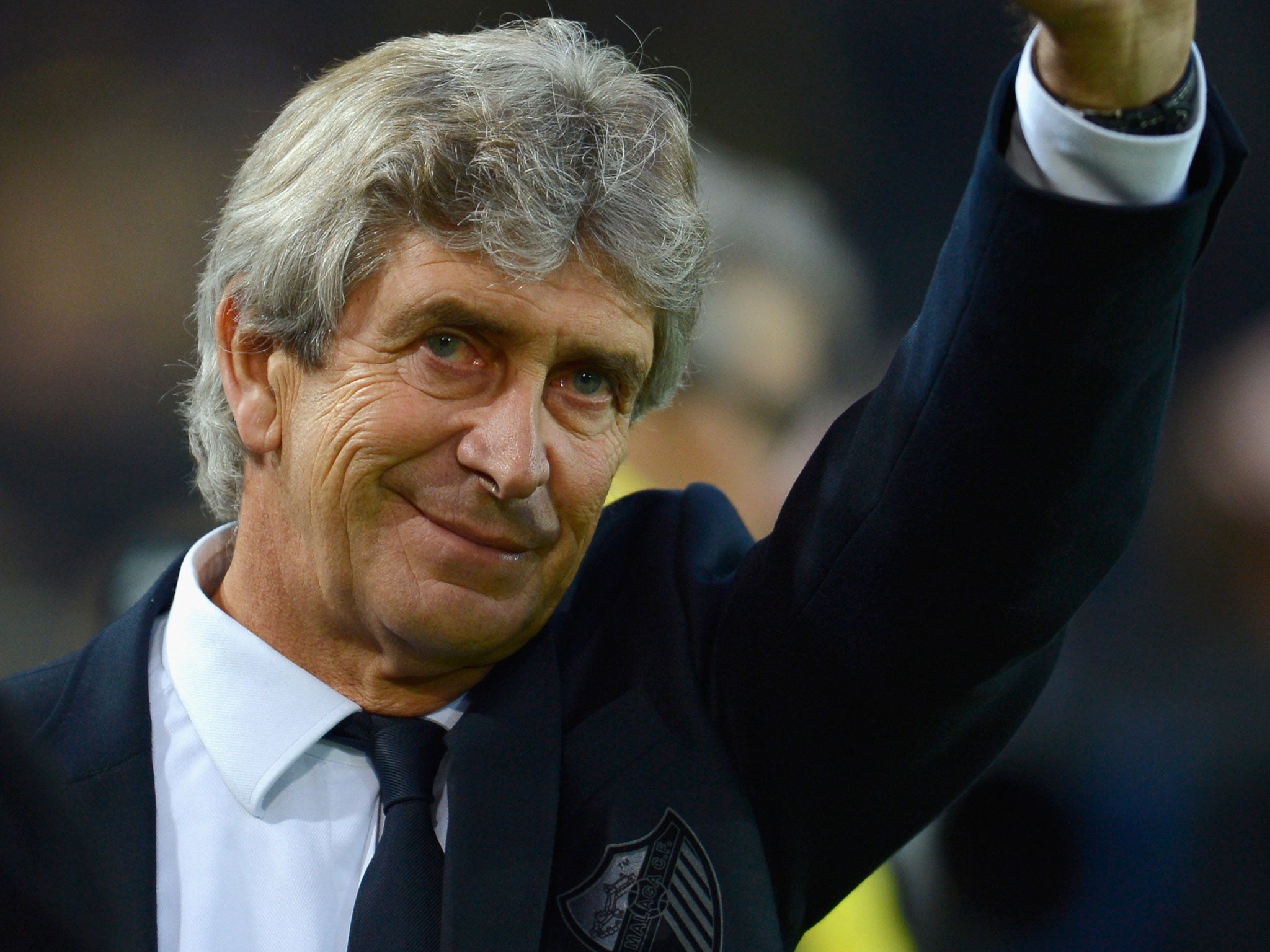 Manuel Pellegrini waves to the Malaga fans