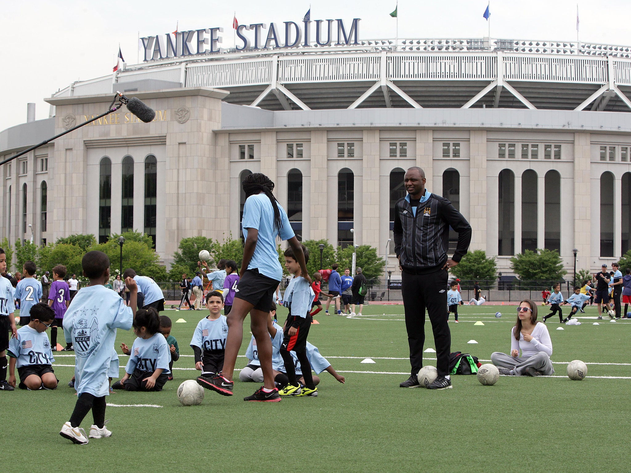 Patrick Vieira takes a training session next to Yankee Stadium