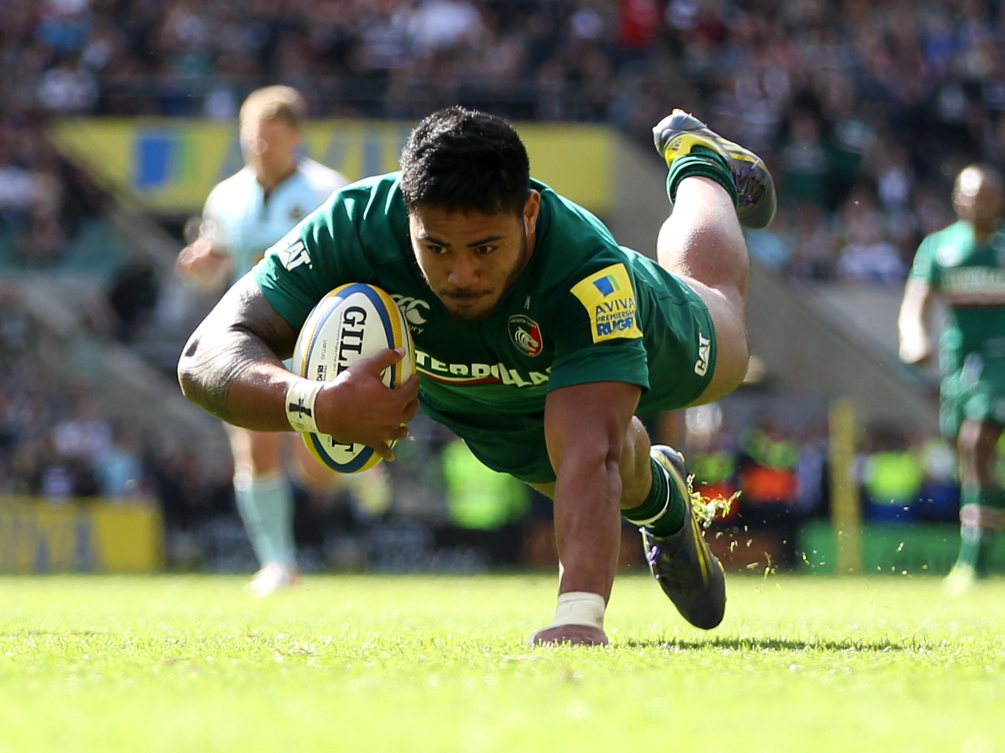 Manu Tuilagi goes over to score