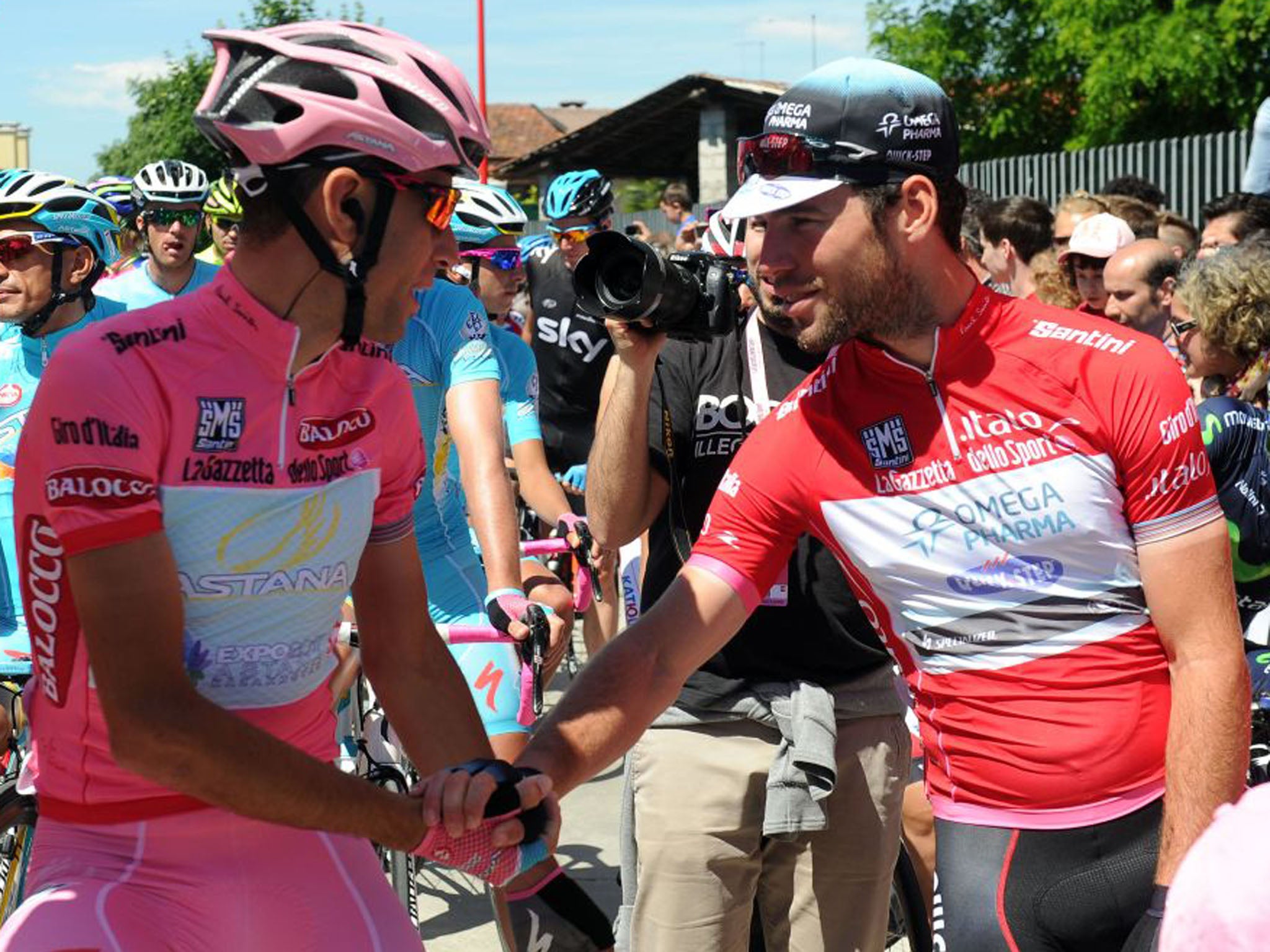 Vincenzo Nibali, left, the overall winner of the Giro d'Italia, greets Mark Cavendish prior to the 21st and last stage of the Giro