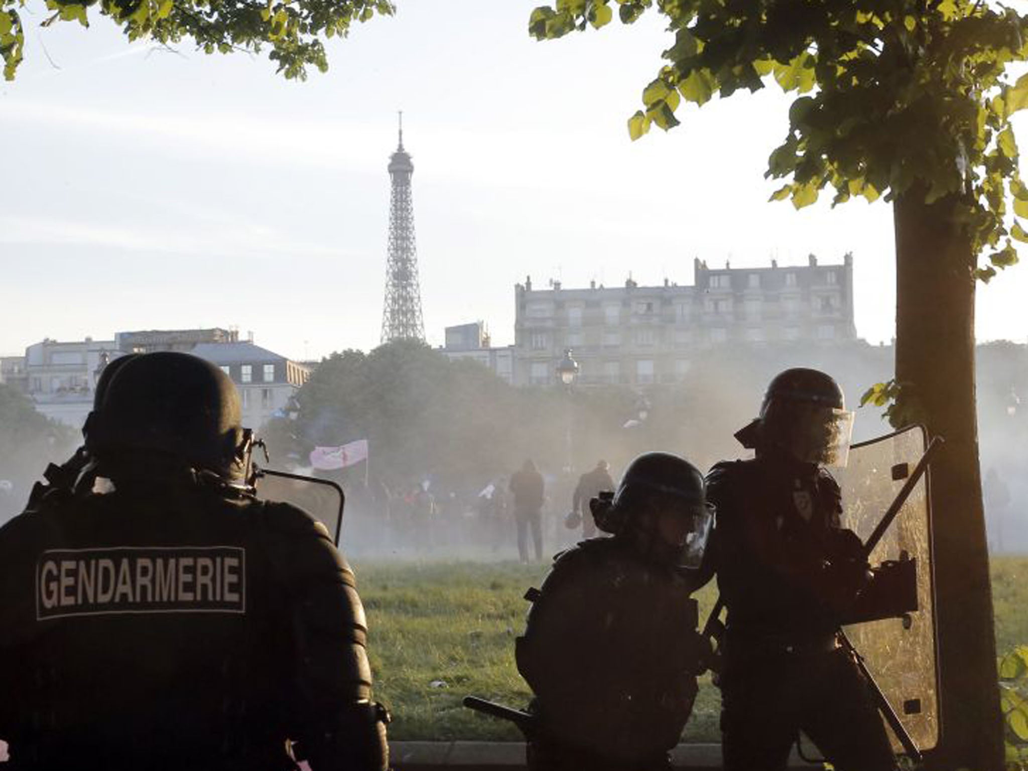 Riot police officers take position (Laurent Cipriani/AP)