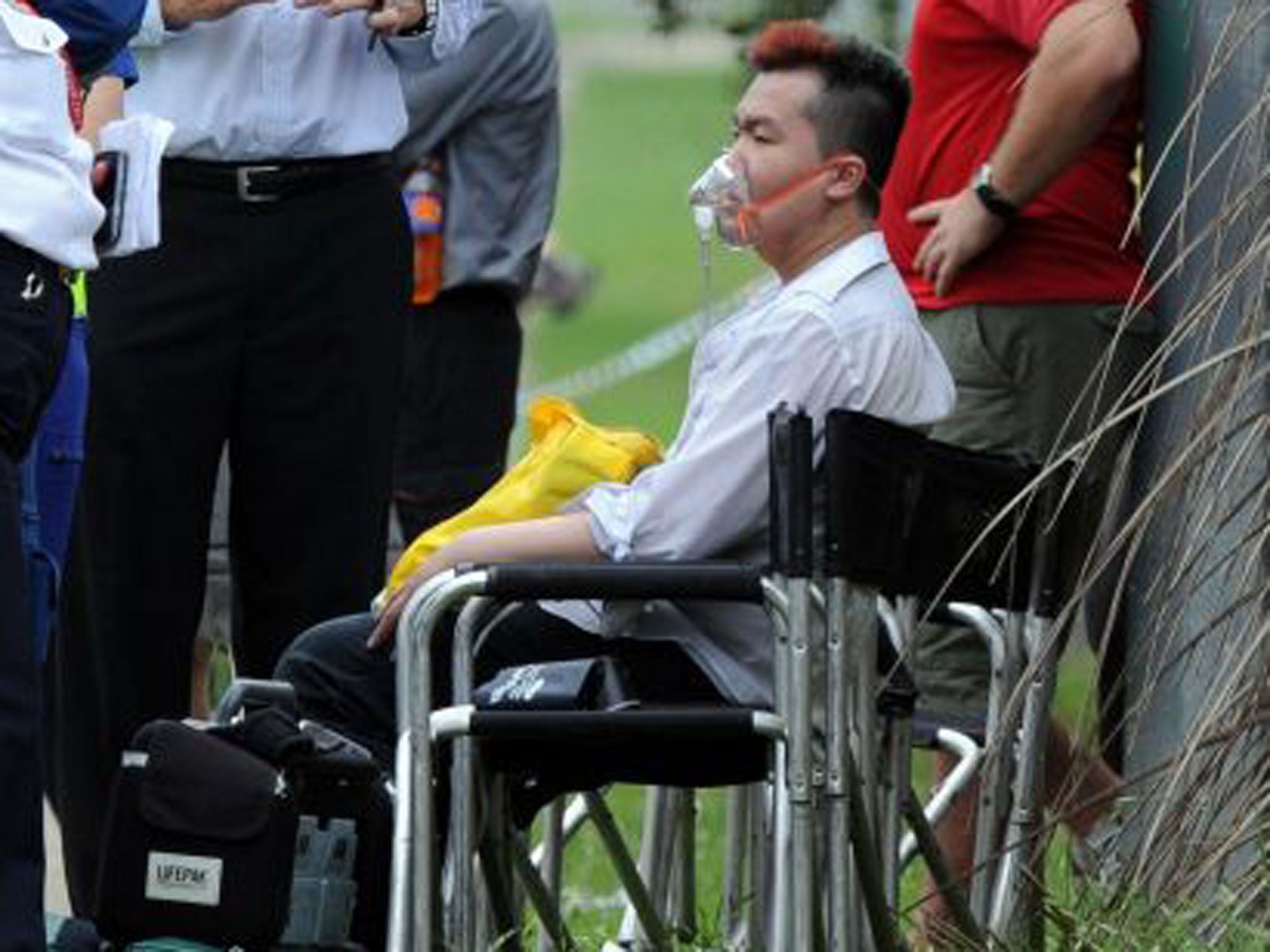 Nurse Roger Dean receiving oxygen after a fire at a rest home killed 11 residents in the outer Sydney suburb of Quakers Hill. Dean has pleaded guilty to starting the fire