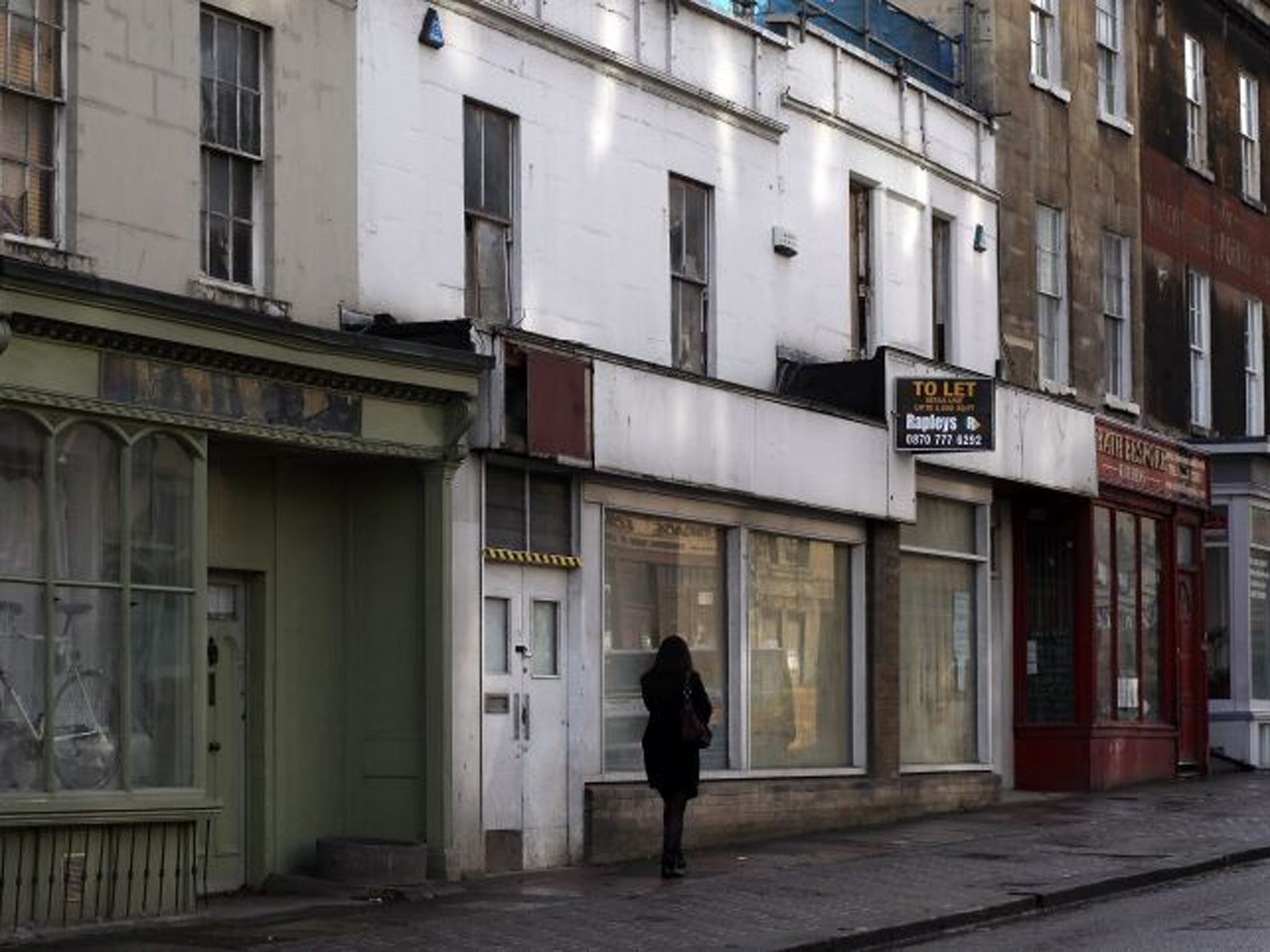 Boarded up shops in Bath
