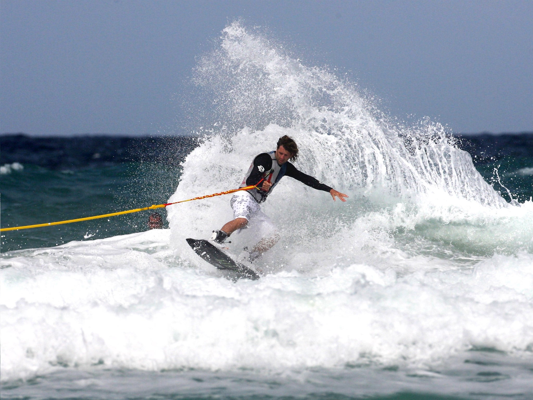 Wakeboarder practising in the water off Fistral Beach, Newquay