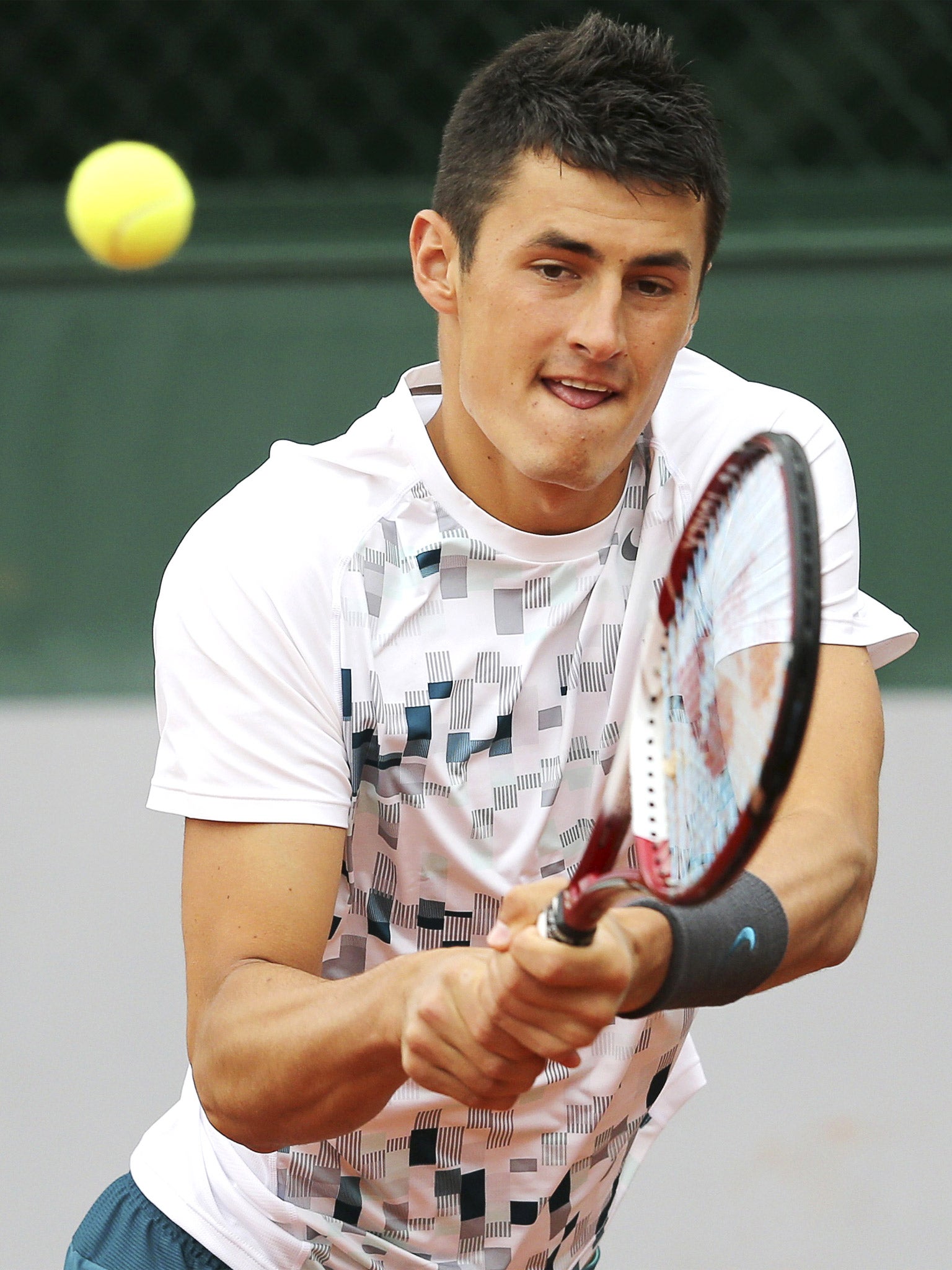 Bernard Tomic in action in Paris before retiring injured