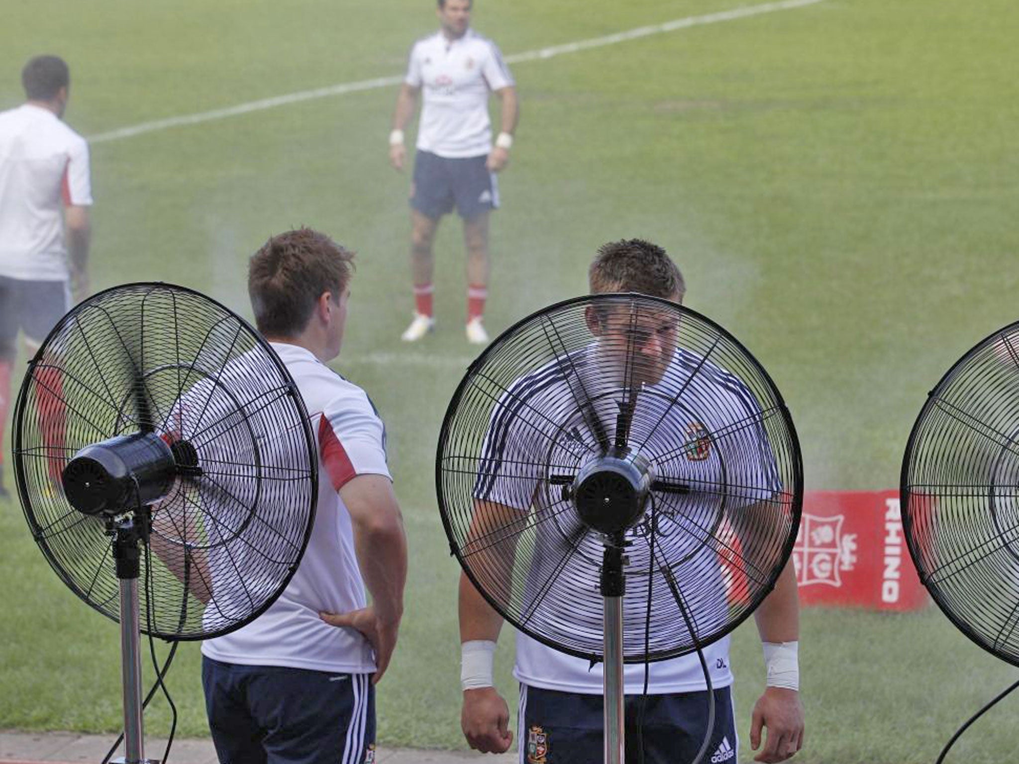 Players of the British and Irish Lions practice under a hot weather during a training session in Hong Kong