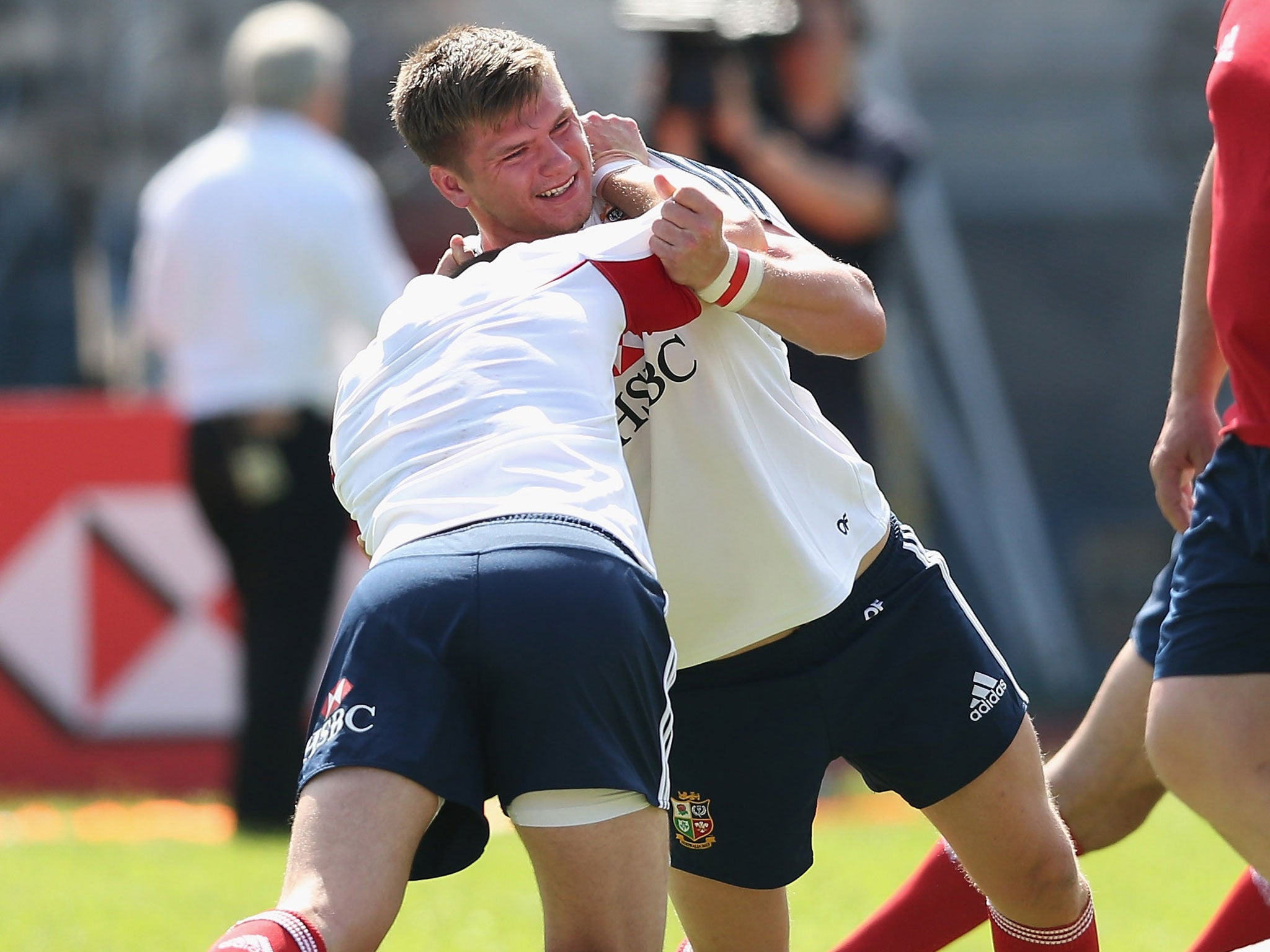 Owen Farrell grapples with Jonny Sexton during training