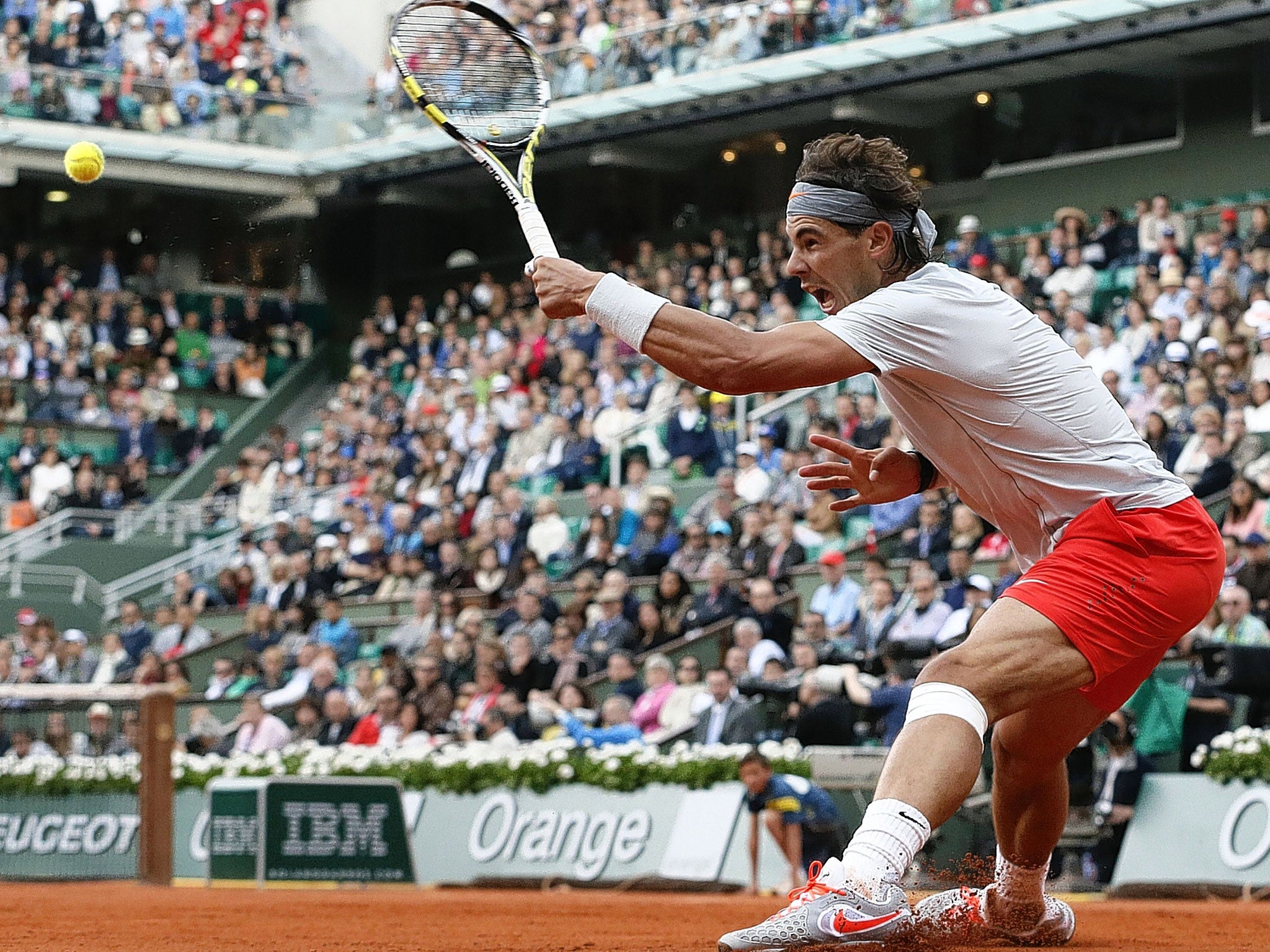 Rafael Nadal of Spain puts in a screaming return in his victory over the Italian Fabio Fognini