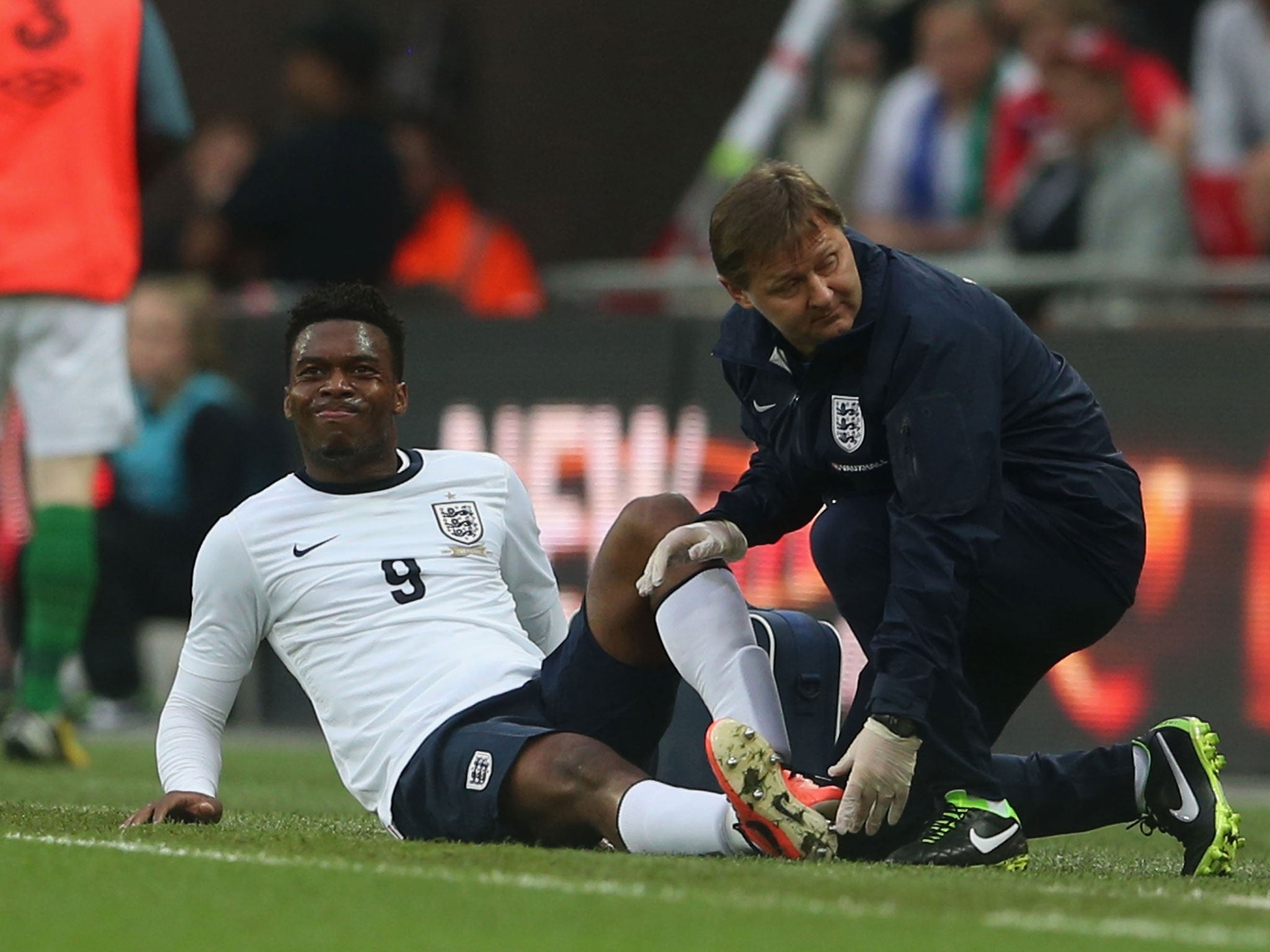 Daniel Sturridge is treated by physio Gary Lewin at Wembley