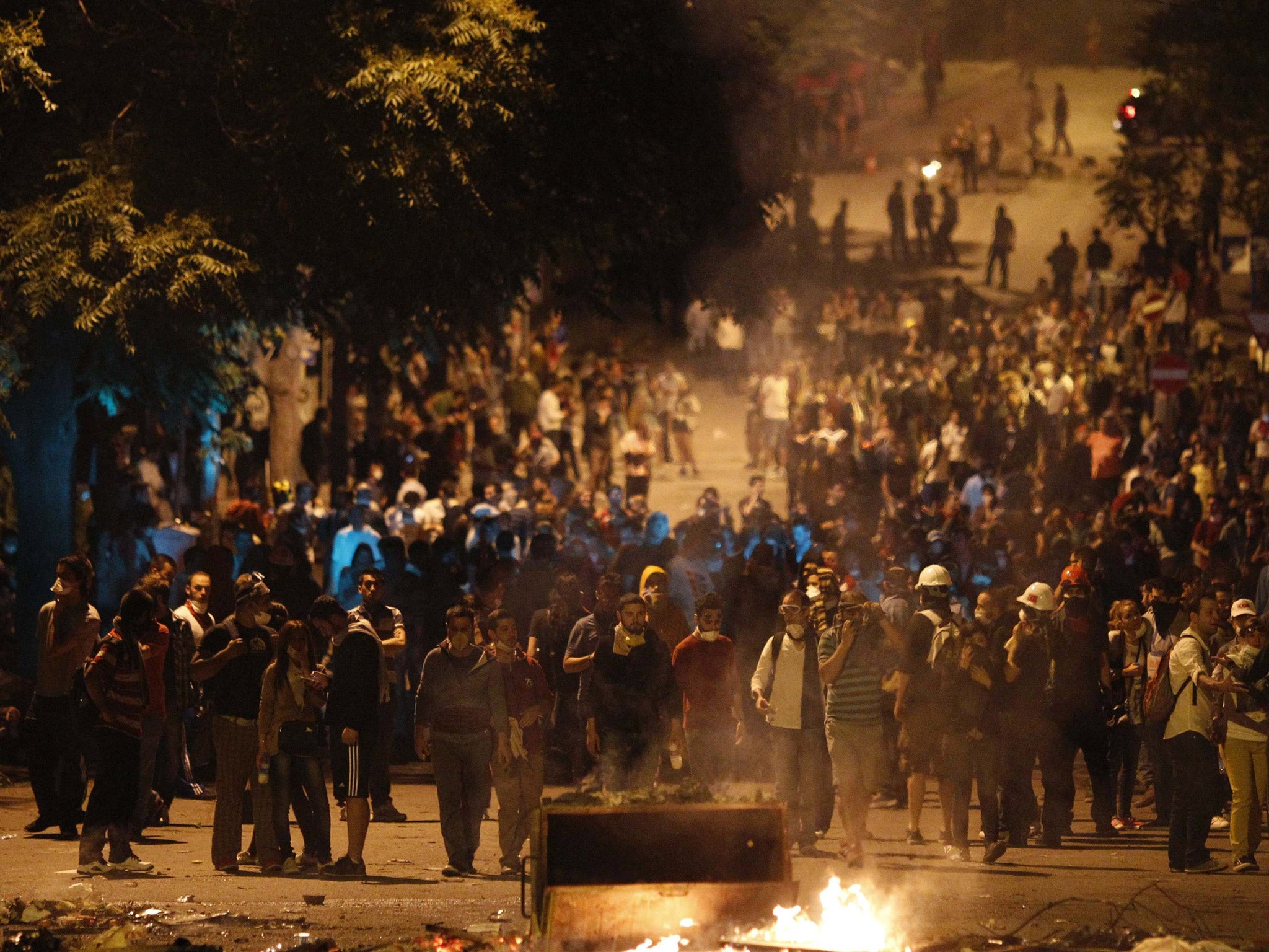 Anti-government protesters clash with riot police during a demonstration in Ankara, Turkey