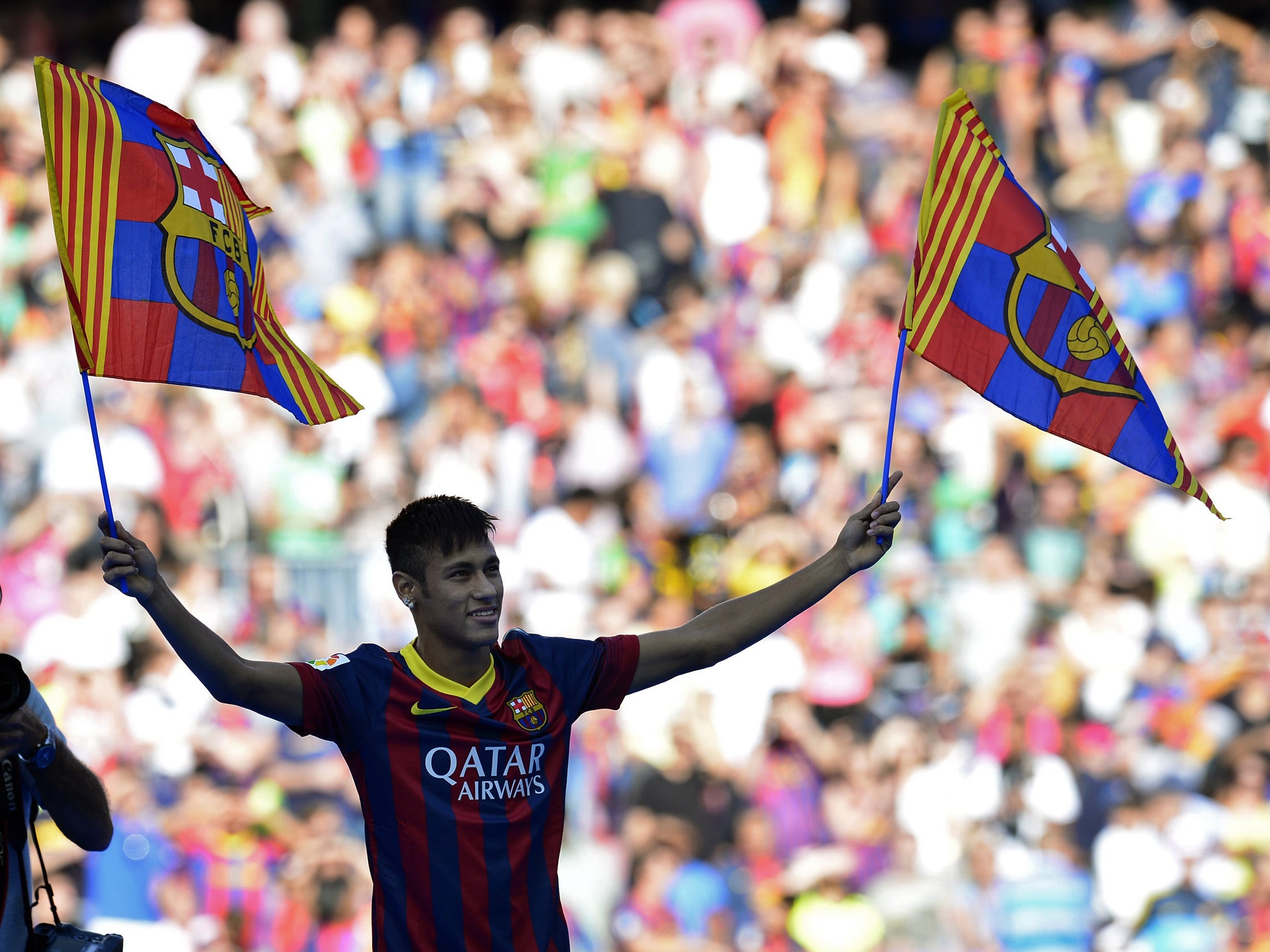 Neymar is presented to Barcelona fans after signing a five-year deal