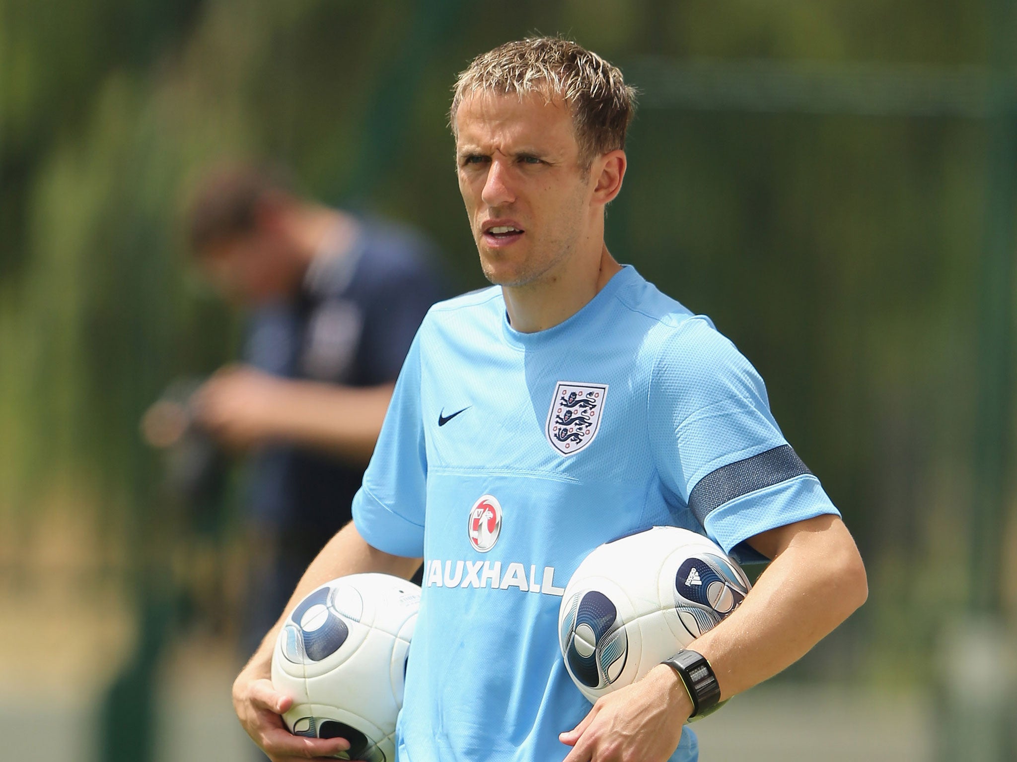 Phil Neville will return to his old club Manchester United as a coach this summer to join David Moyes' backroom staff