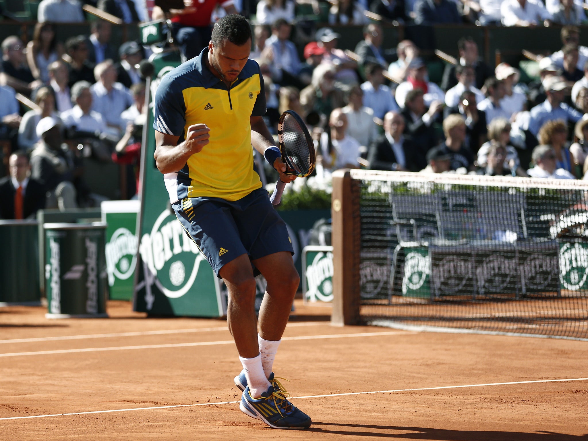 Jo-Wilfried Tsonga reacts during his quarter-final victory over Roger Federer