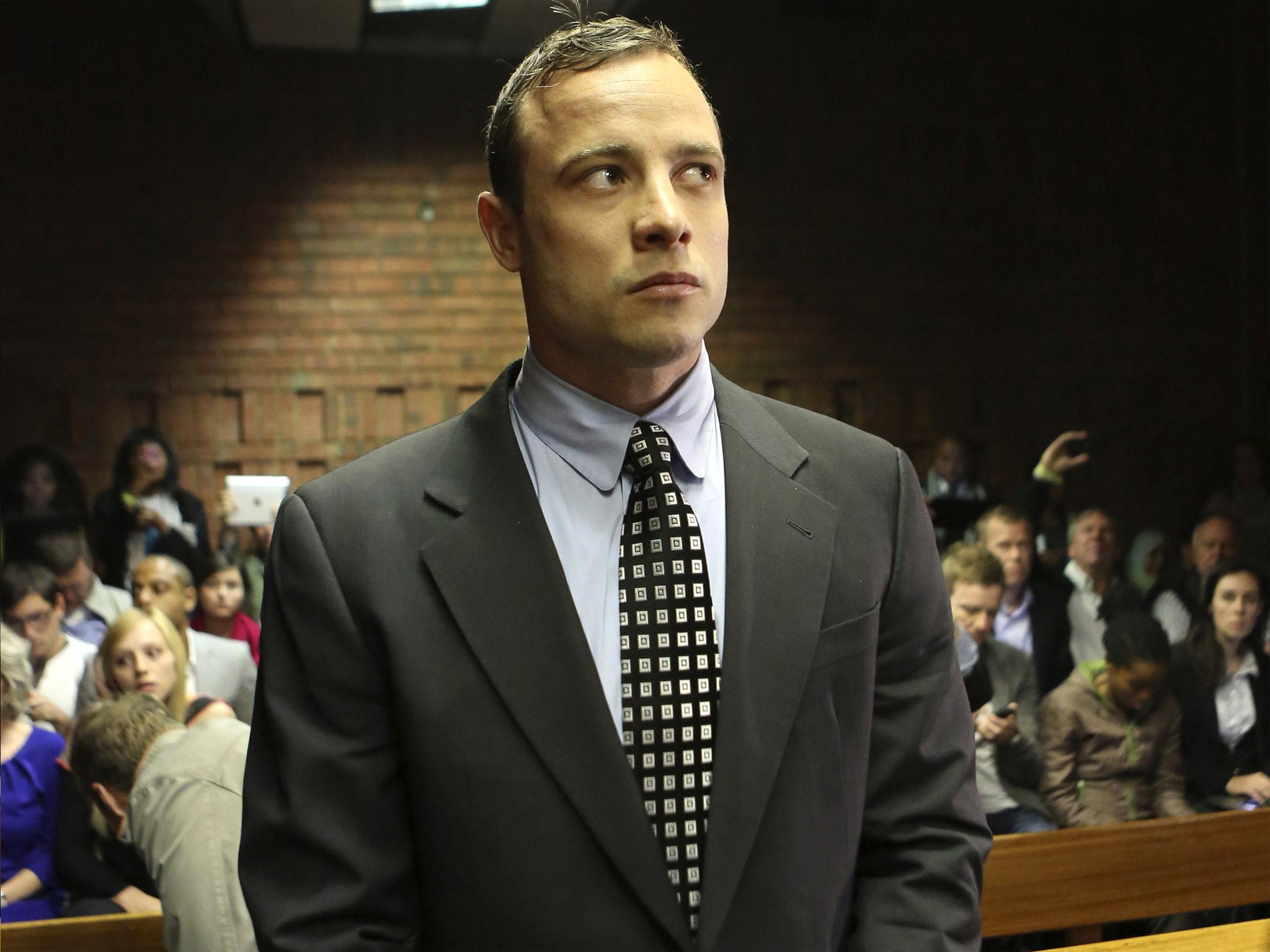 Oscar Pistorius enters the dock at the Pretoria Magistrates court