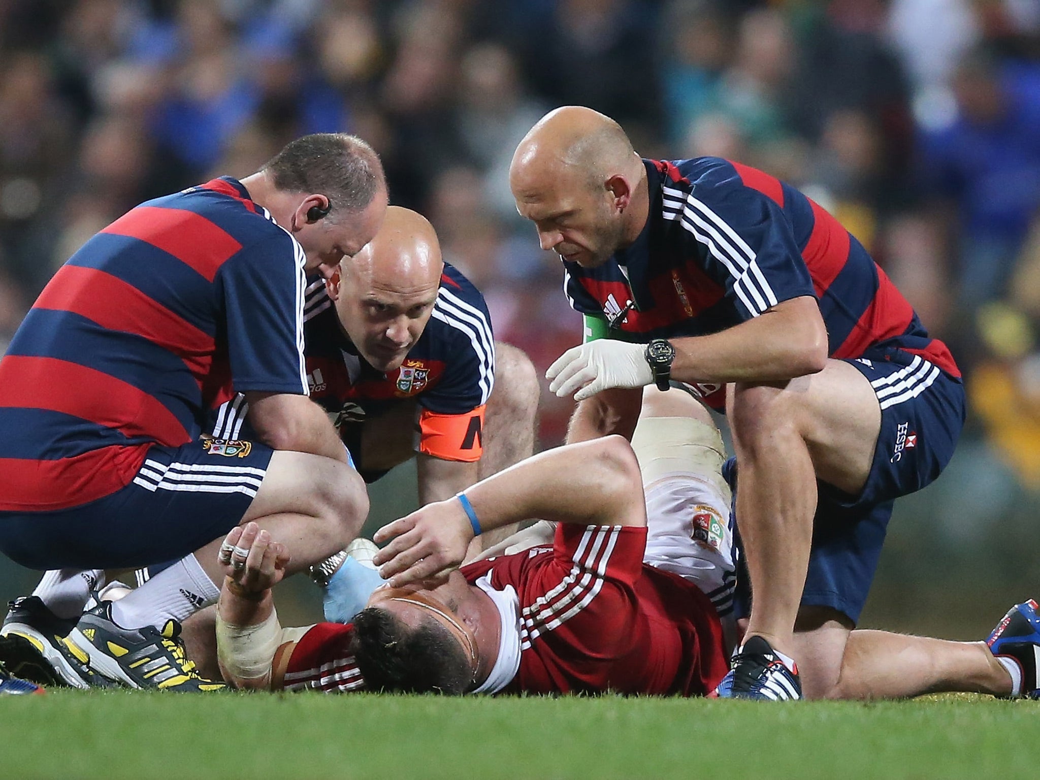 Medics attend to Cian Healey during the warm-up against Western Force