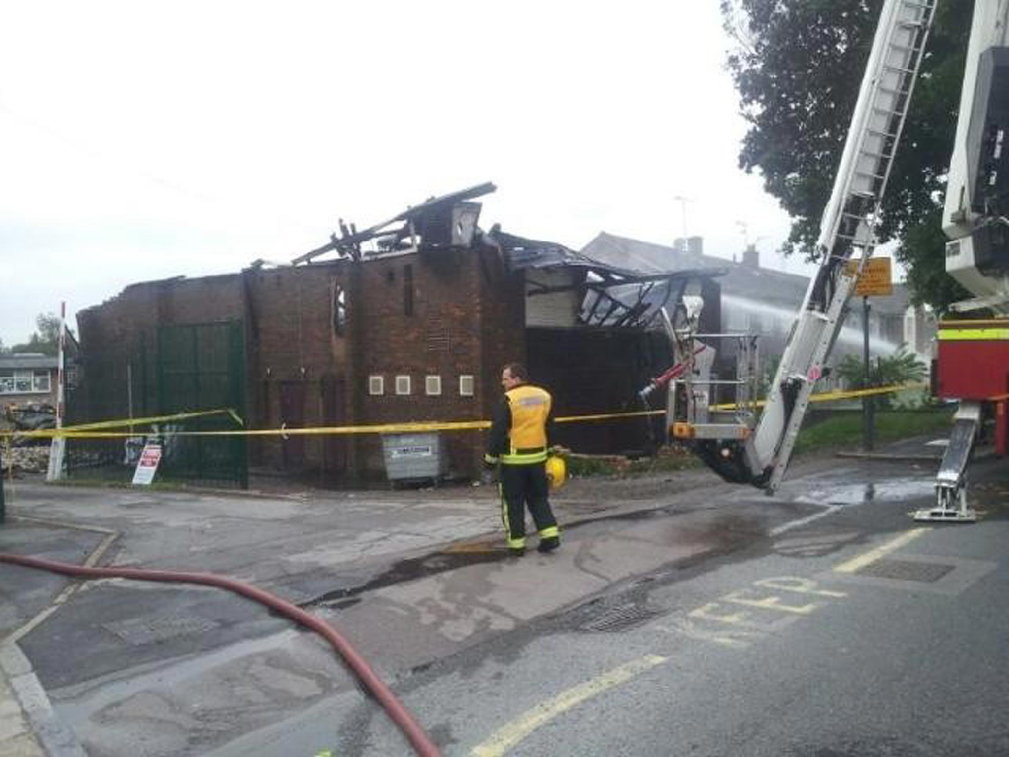 Firefighters tackle the blaze at the Somali Bravanese Welfare Association and the Al-Rahma Islamic Centre