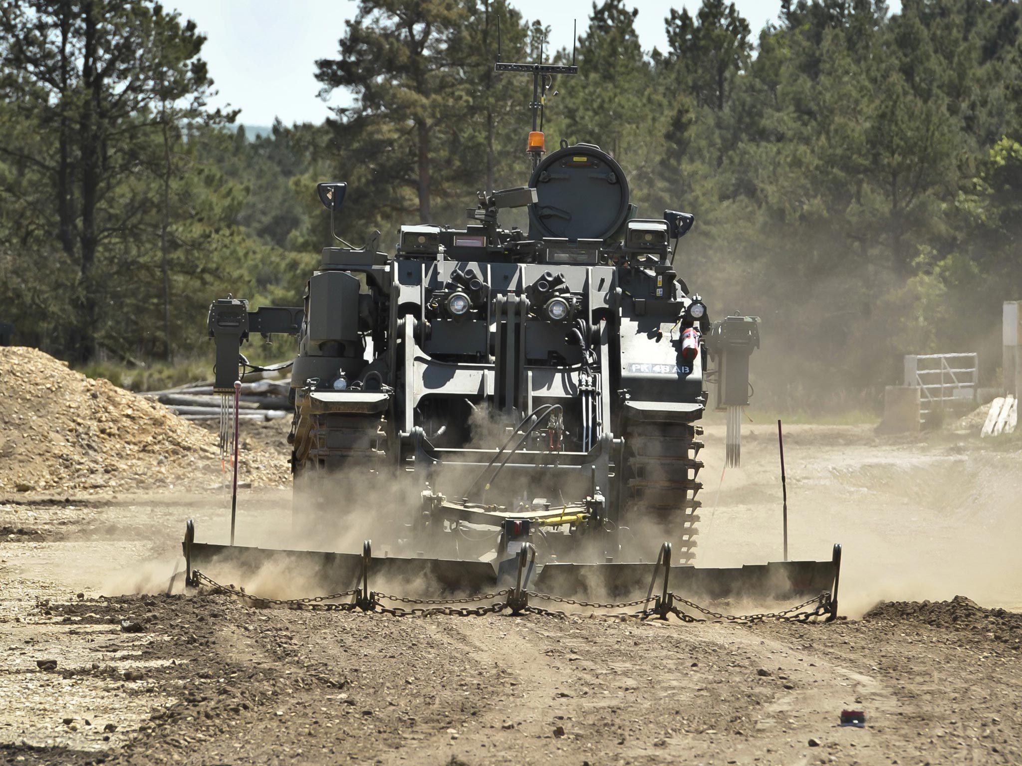A Terrier armoured digger in the mine clearance role, which is entirely controlled remotely during an unveiling at the Defence Armoured Vehicle Centre, Bovington, Dorset - PA