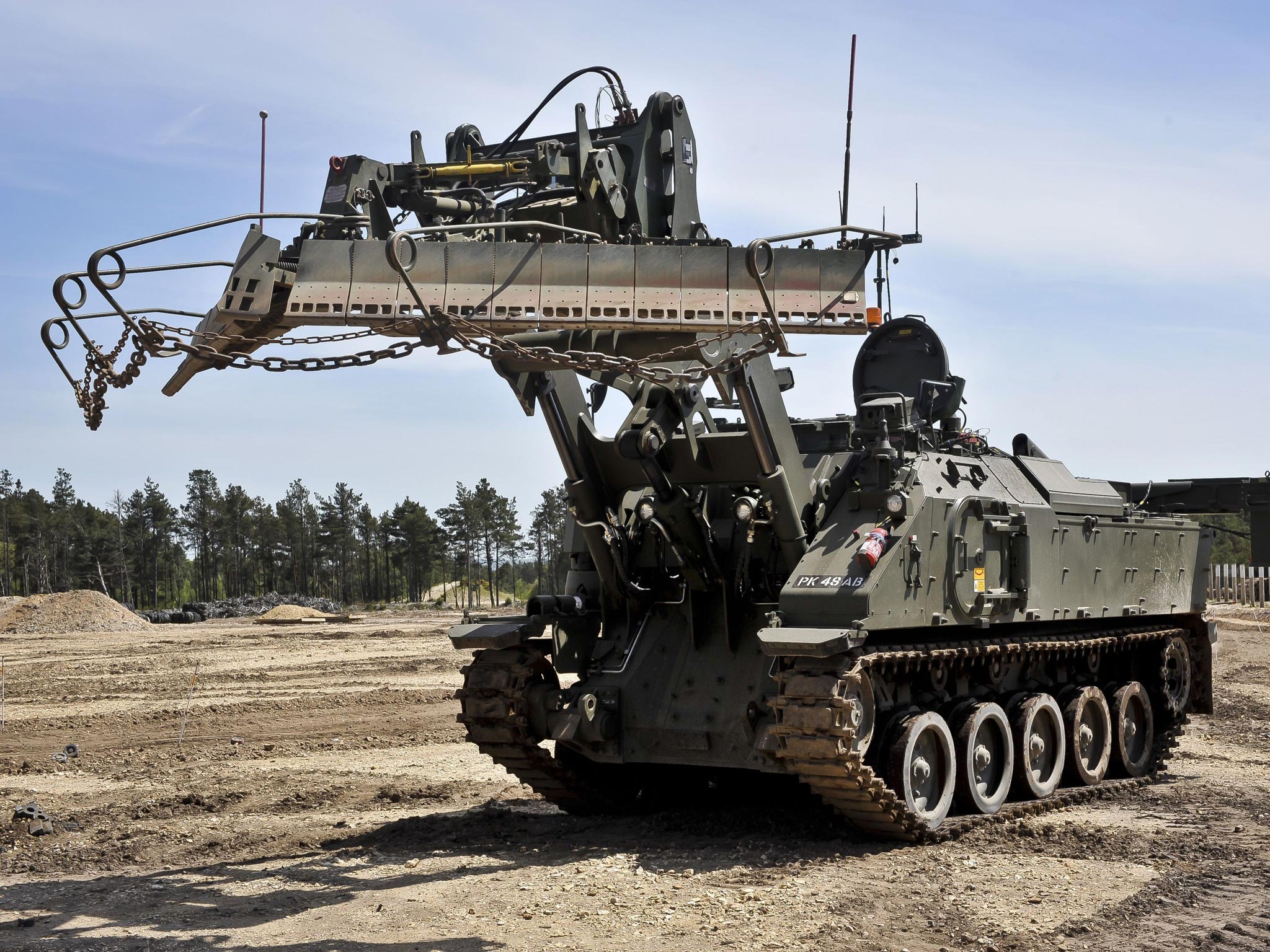 A Terrier armoured digger in the mine clearance role, which is entirely controlled remotely during an unveiling at the Defence Armoured Vehicle Centre, Bovington, Dorset. PA