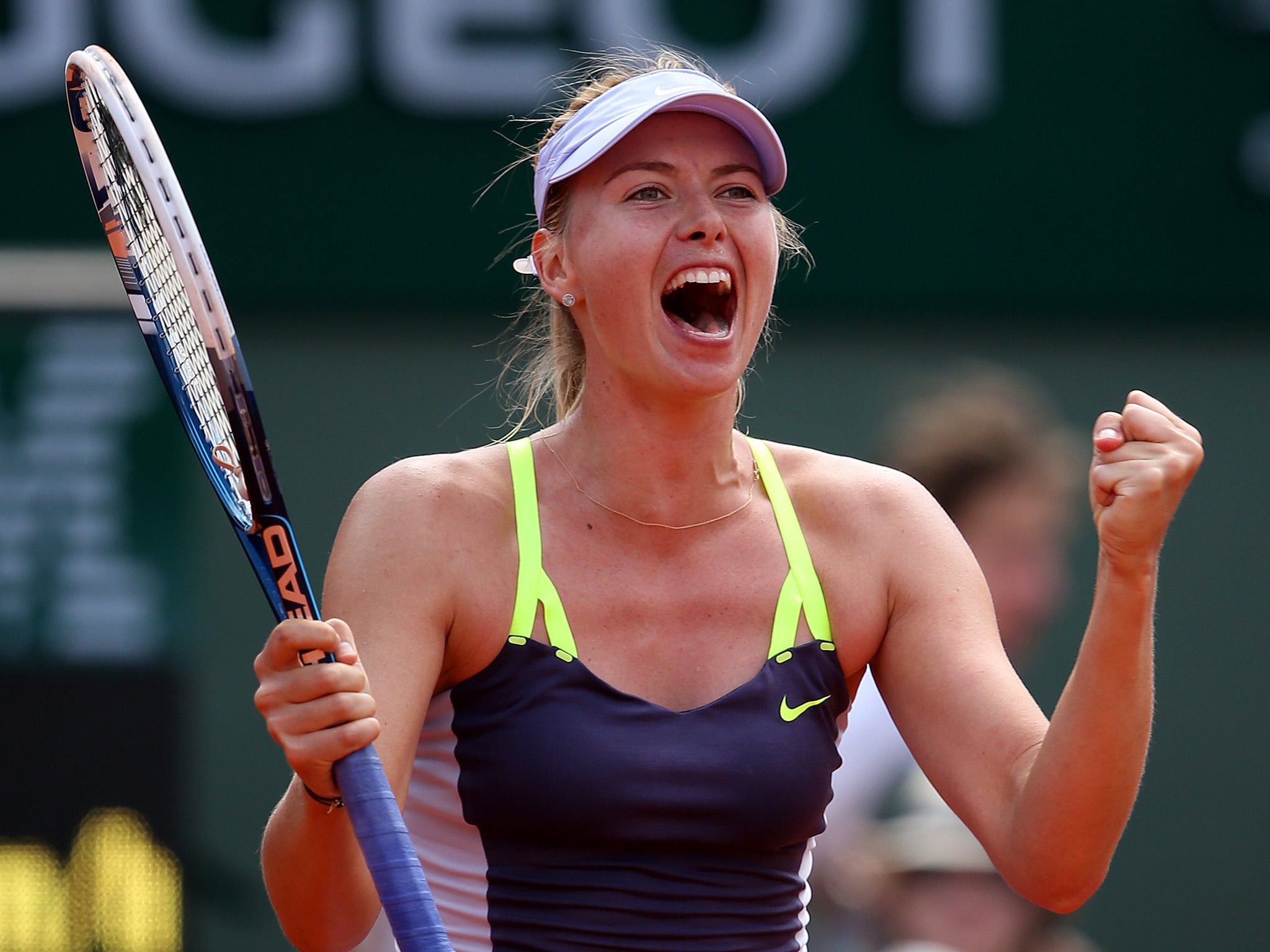 Maria Sharapova celebrates after reaching the semi-finals of the French Open