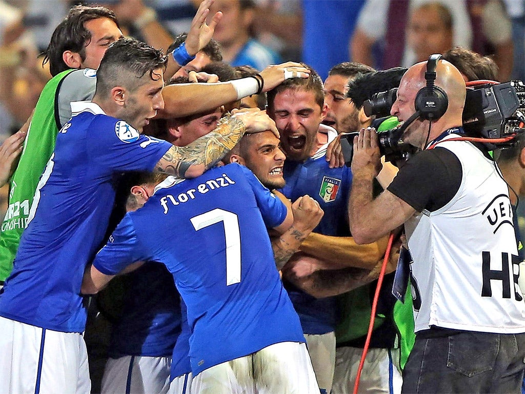 Lorenzo Insigne of Italy celebrates his goal - down the television camera lens