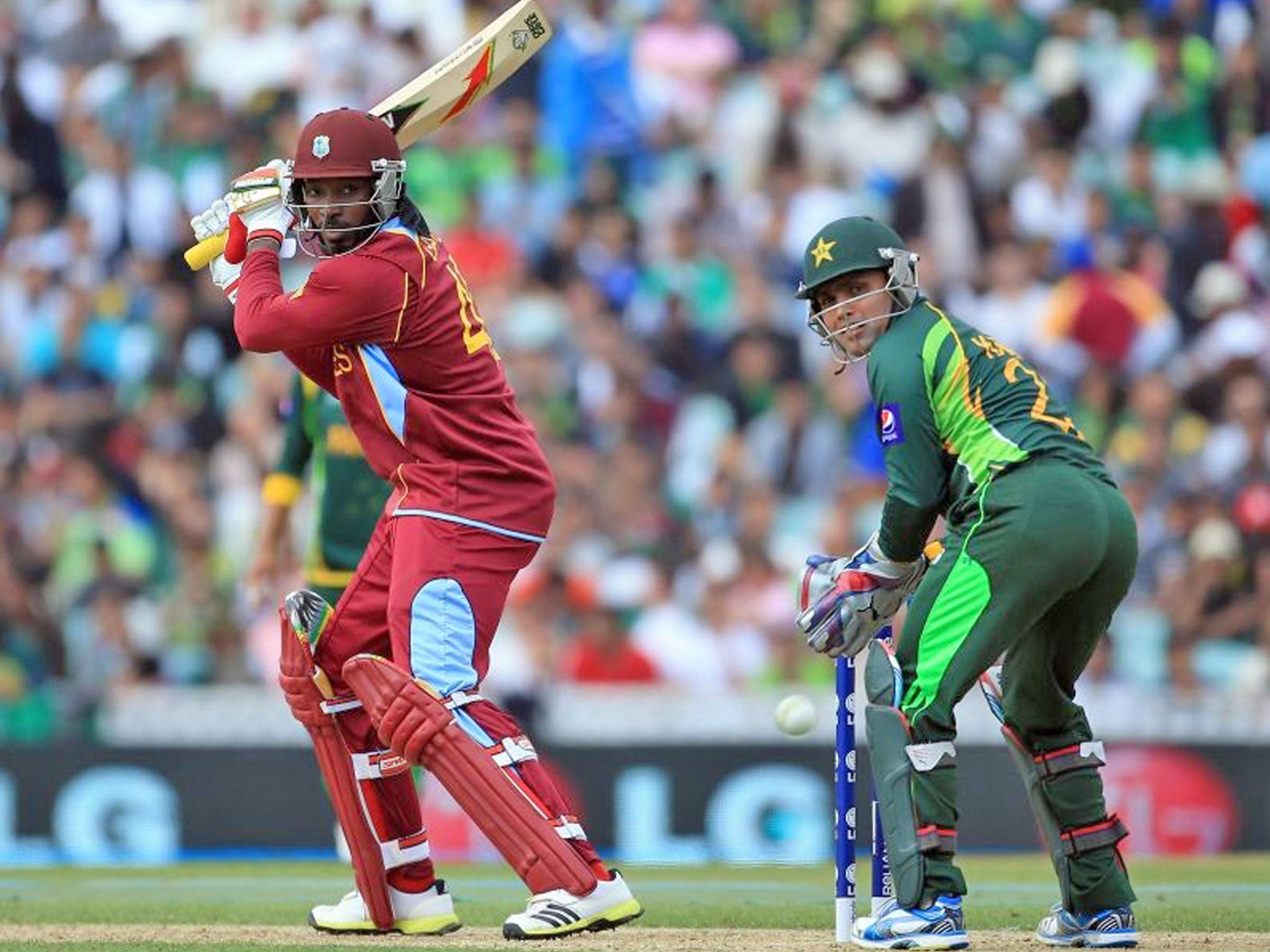 Chris Gayle of West Indies hits the ball to the boundary during the ICC Champions Trophy group B match