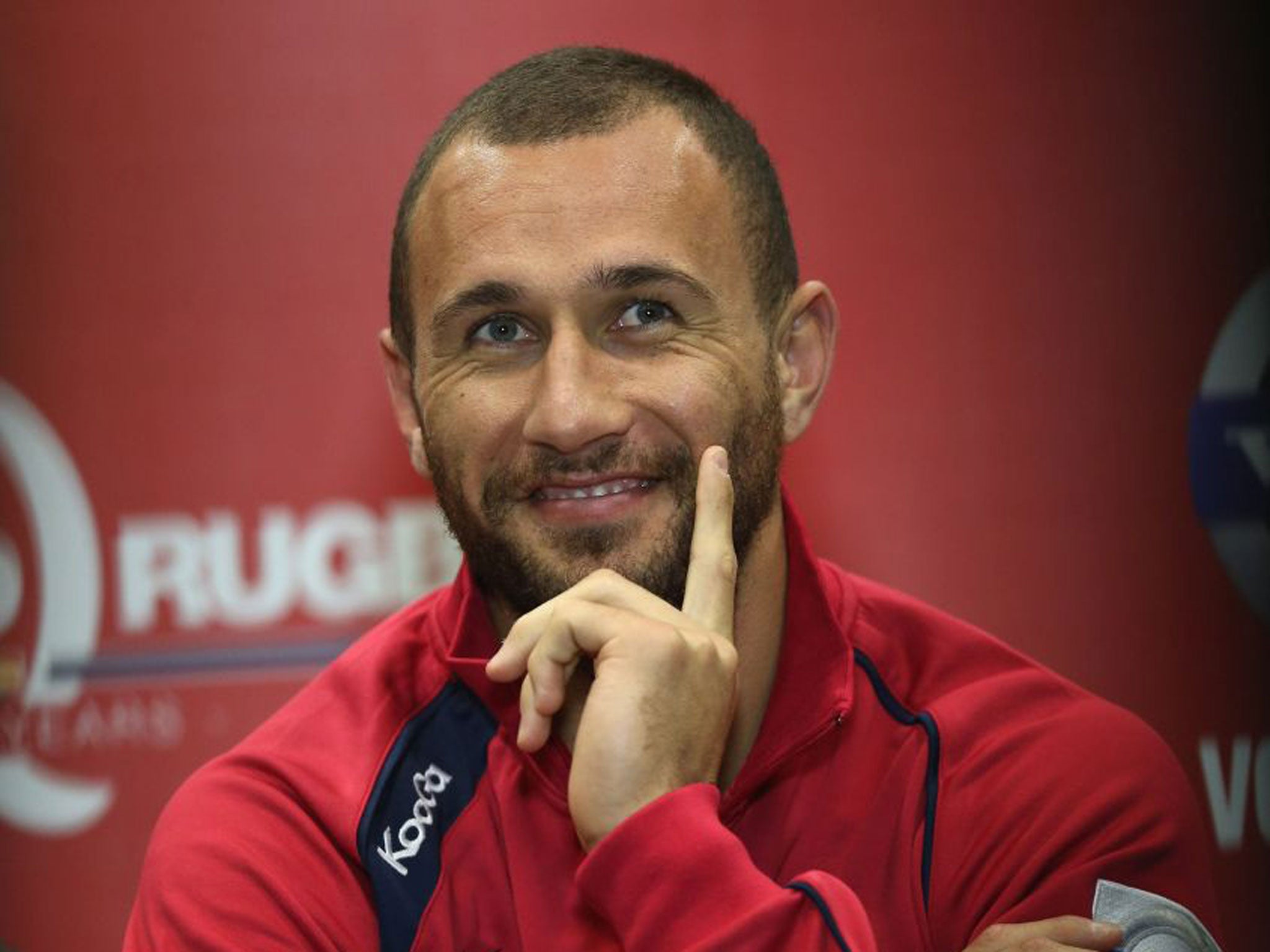 Quade Cooper in Brisbane yesterday and with Wallabies coach Robbie Deans last year