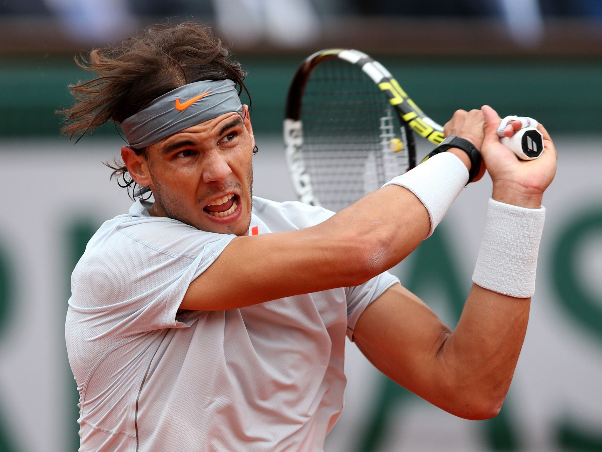 Rafael Nadal of Spain plays a backhand during the Men's Singles final match against David Ferrer