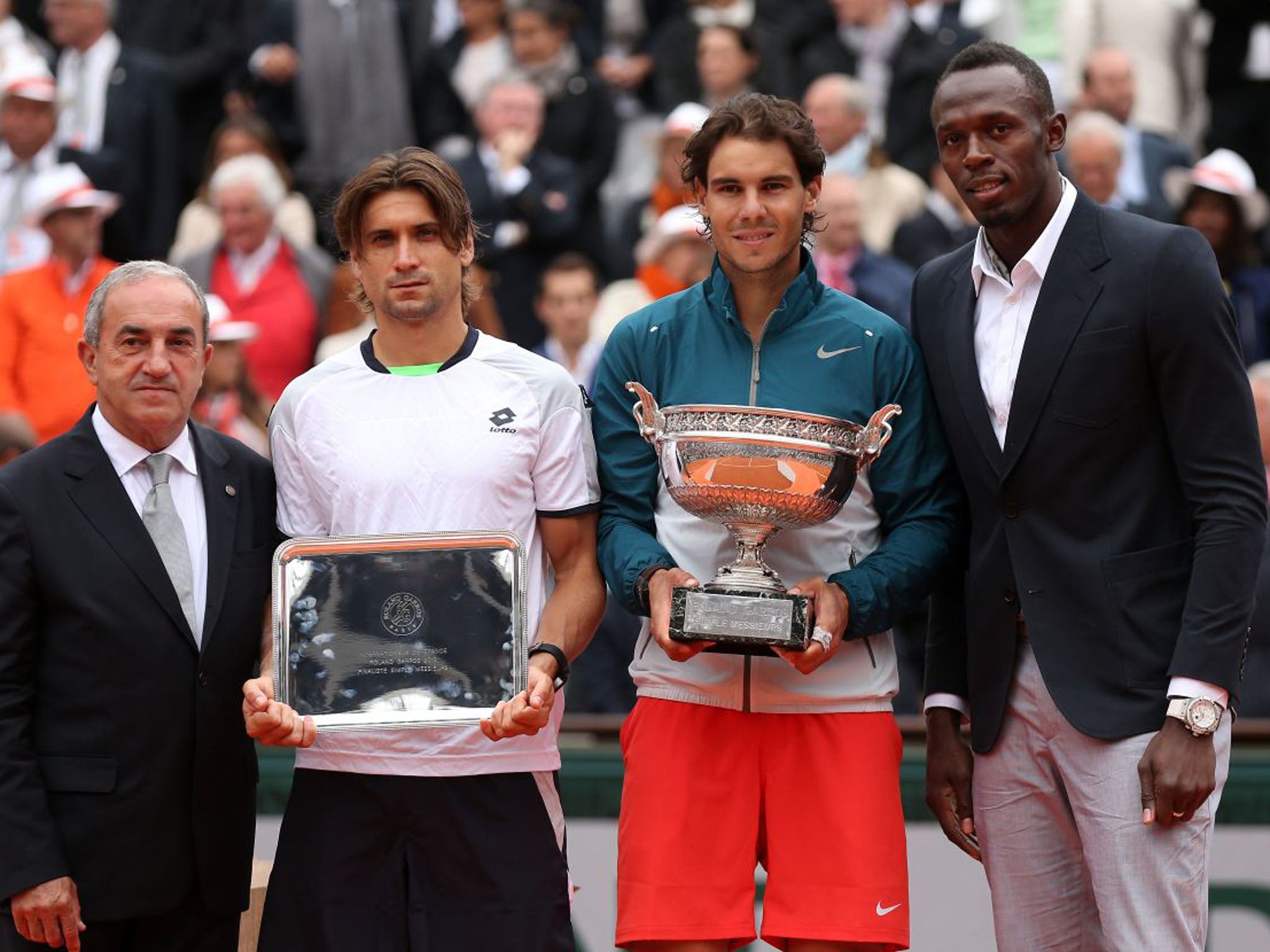 From left to right: President of the International Tennis Federation Francesco Bitti Ricci, runner up David Ferrer of Spain, winner Rafael Nadal of Spain and Olympic champion Usain Bolt pose after the final