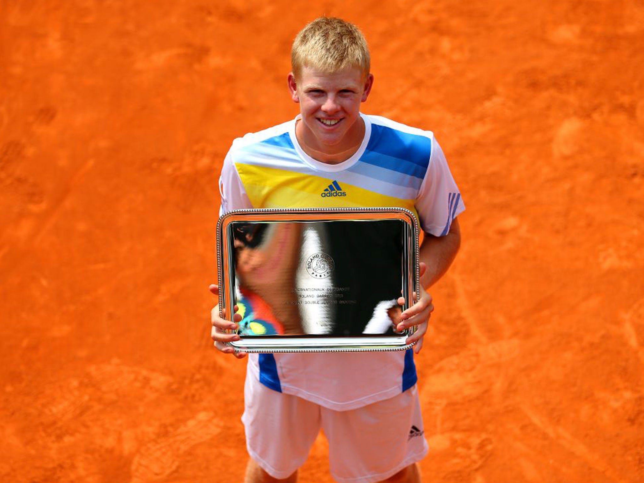 Kyle Edmund shows off his winner’s plate at Roland Garros