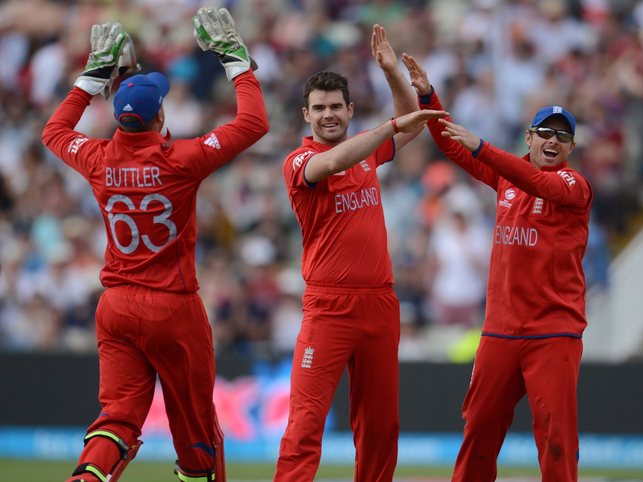 James Anderson, centre, celebrates another wicket with Jos Buttler, left, and Ian Bell, right