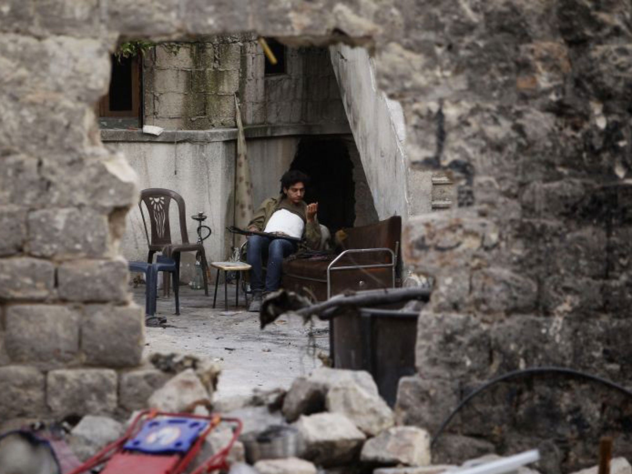 A rebel fighter in Aleppo, which could soon come under an assault from pro-Assad forces