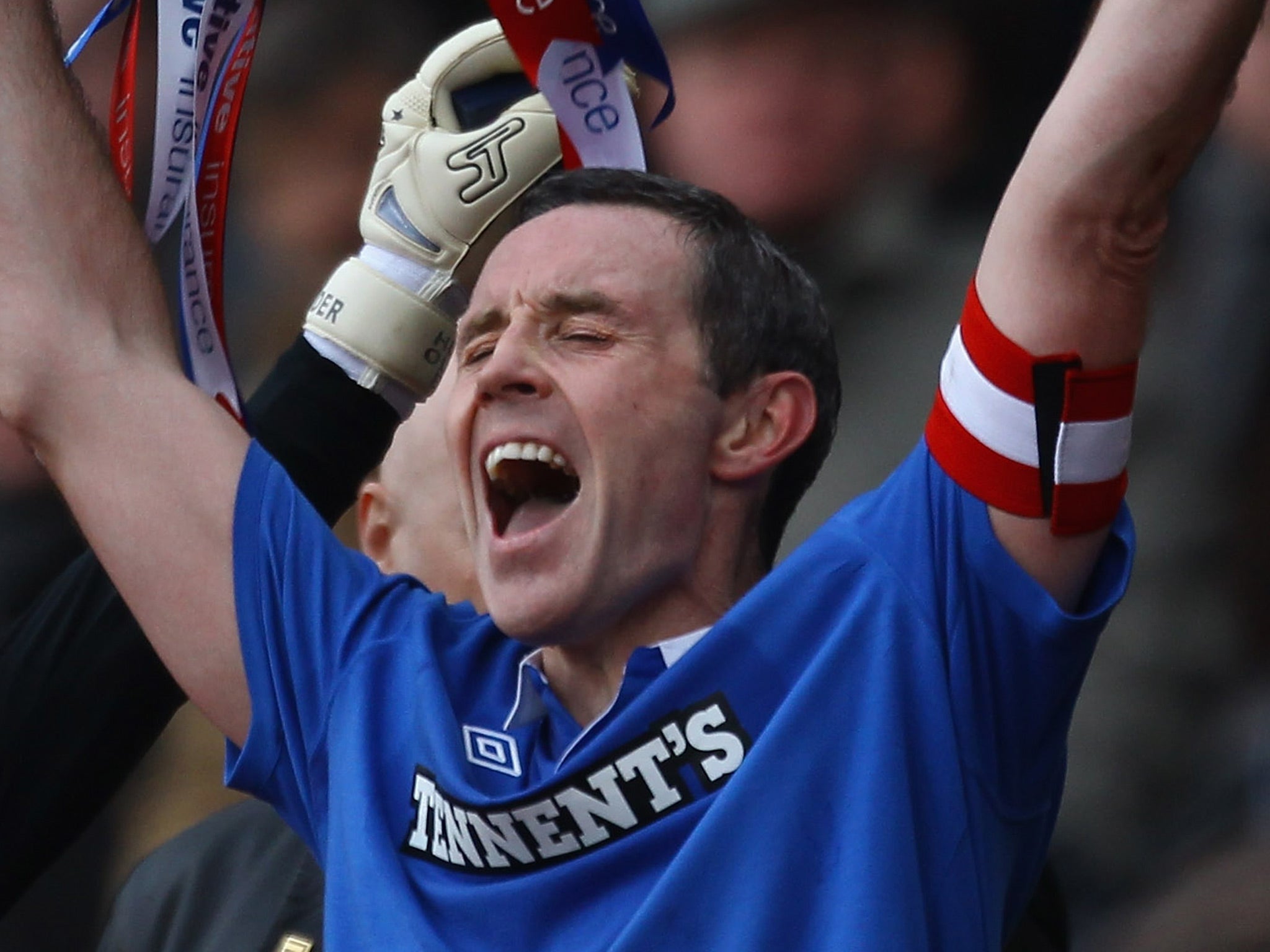 David Weir captain of Rangers lifts the Co-operative Insurance Cup after beating Celtic in the final at Hampden Park on March 20, 2011