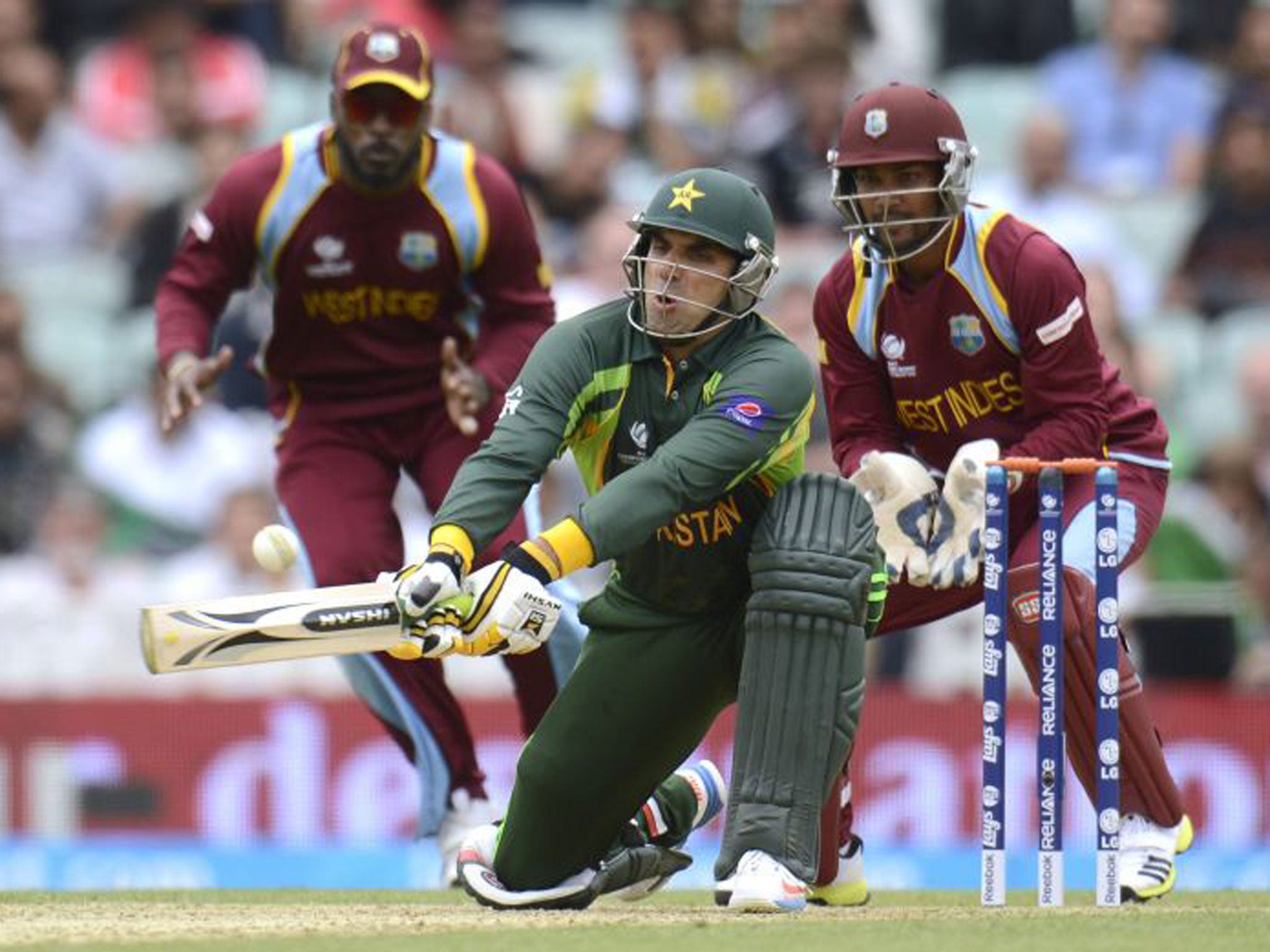 Denesh Ramdin (right) watches Misbah-ul-Haq bat in Friday’s controversial