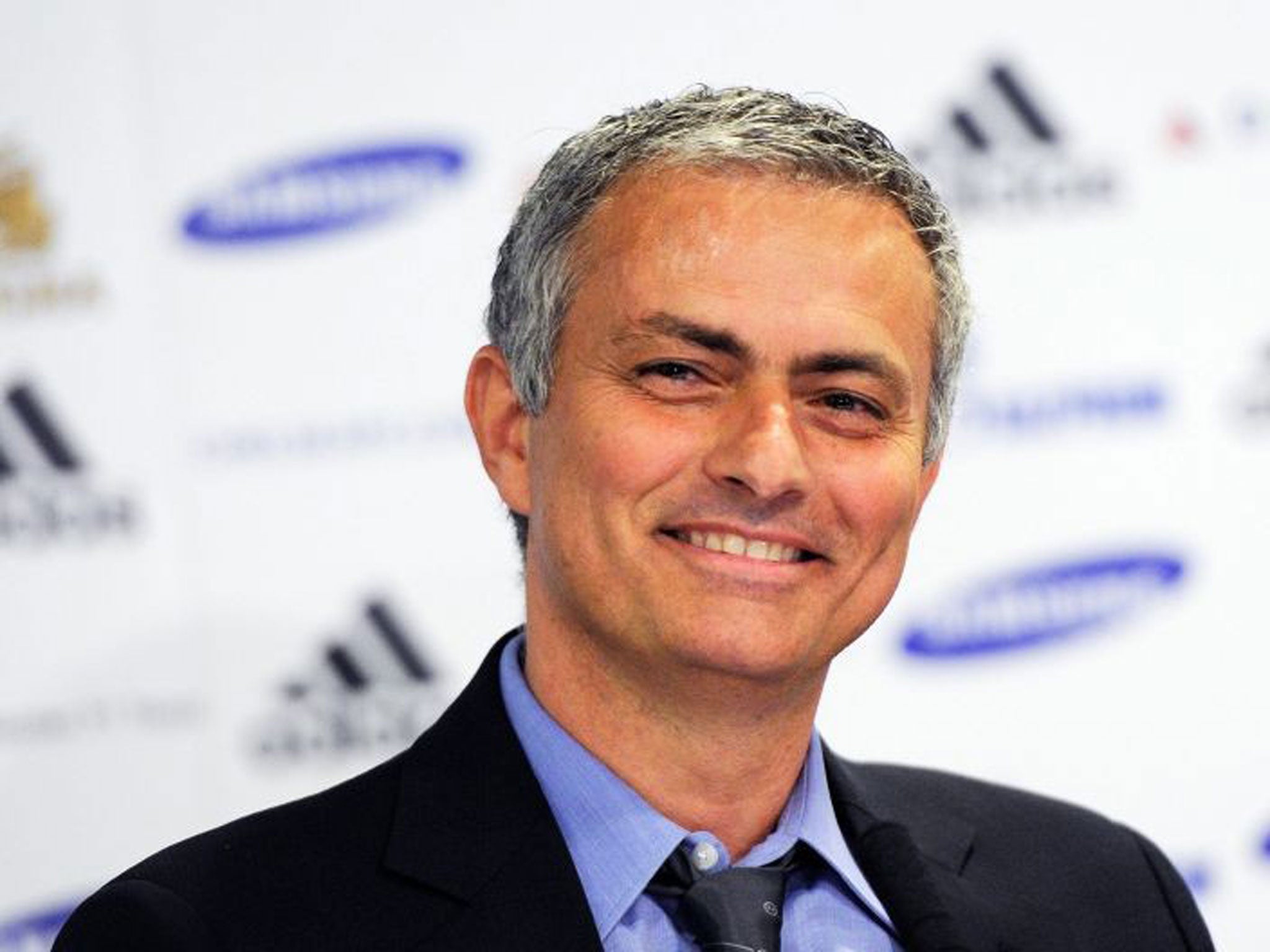 Jose Mourinho reacts with a smile during his first press conference as the new Chelsea manager at Stamford Bridge in London (EPA)