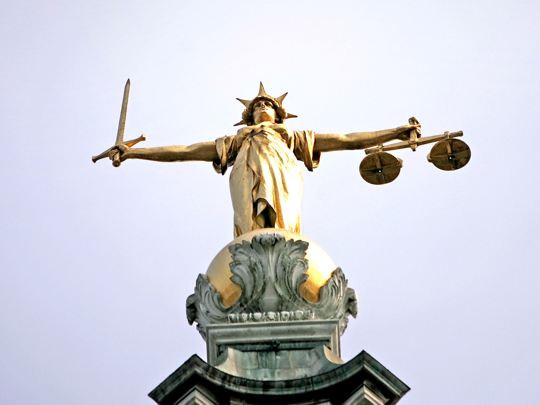 Scales of justice: the Ministry of Justice is pushing through a £220 million annual cut to the criminal legal aid bill