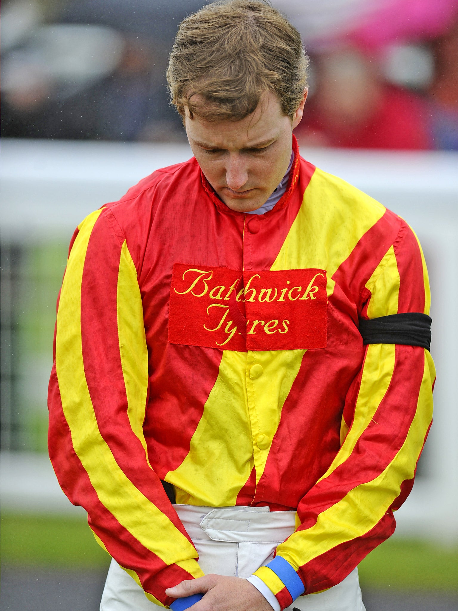 Cecil’s jockey Tom Queally wears a black armband yesterday