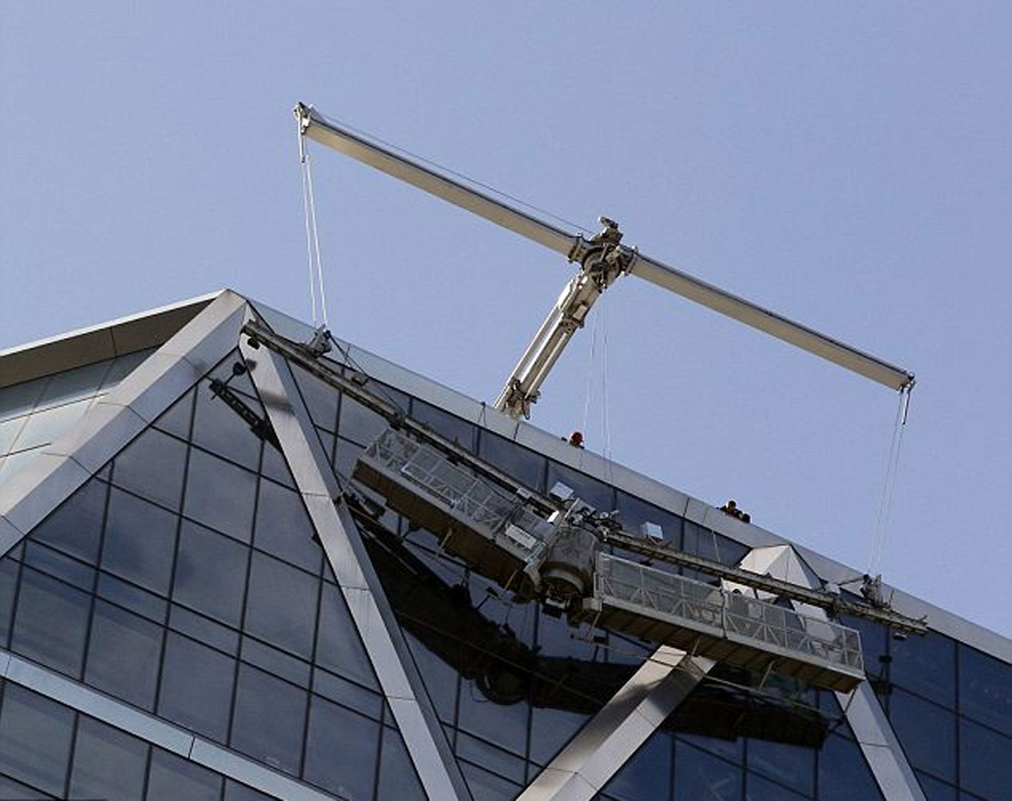 Two New York scaffold workers have been rescued from the 46th floor of a skyscraper after their metal rigging bent in half, leaving them trapped for around 90 minutes.